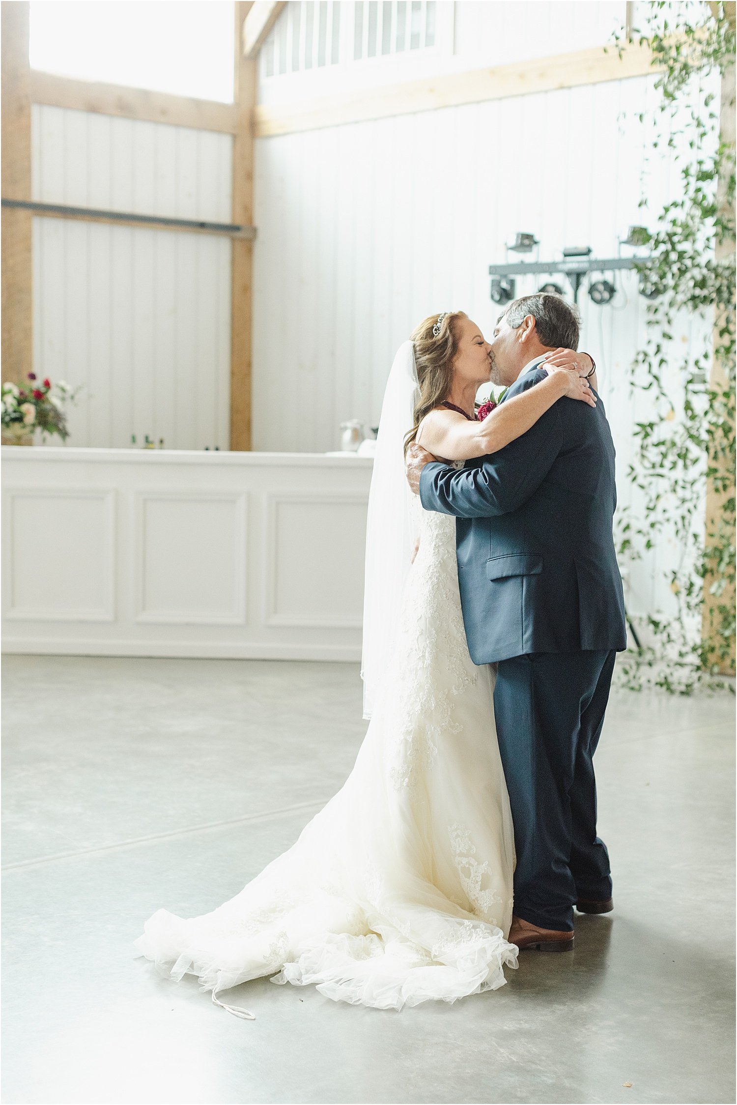 Bride and Groom Kissing During First Dance