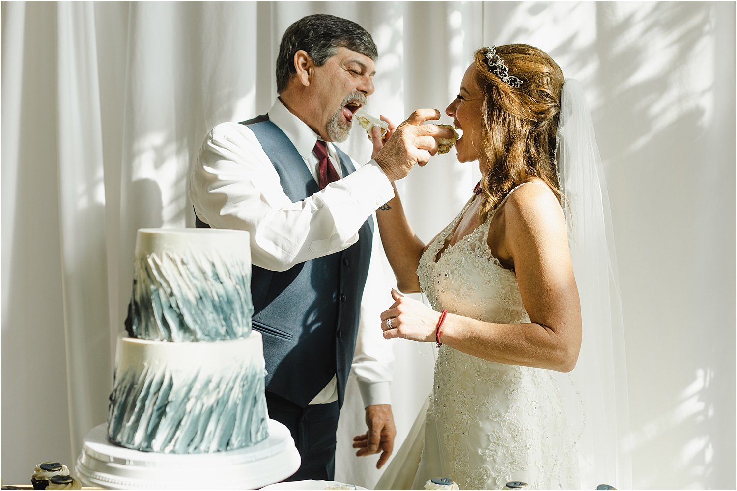 Bride and Groom Feed Each Other Cake