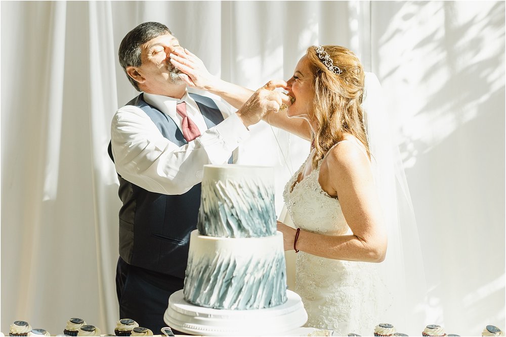 Bride and Groom Feed Each Other Cake