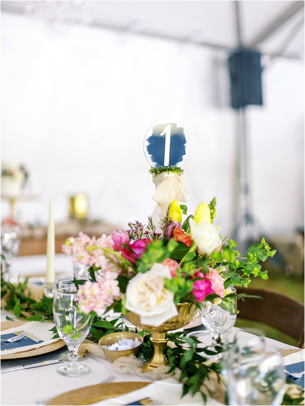Table numbers and beautiful summer bouquet 
