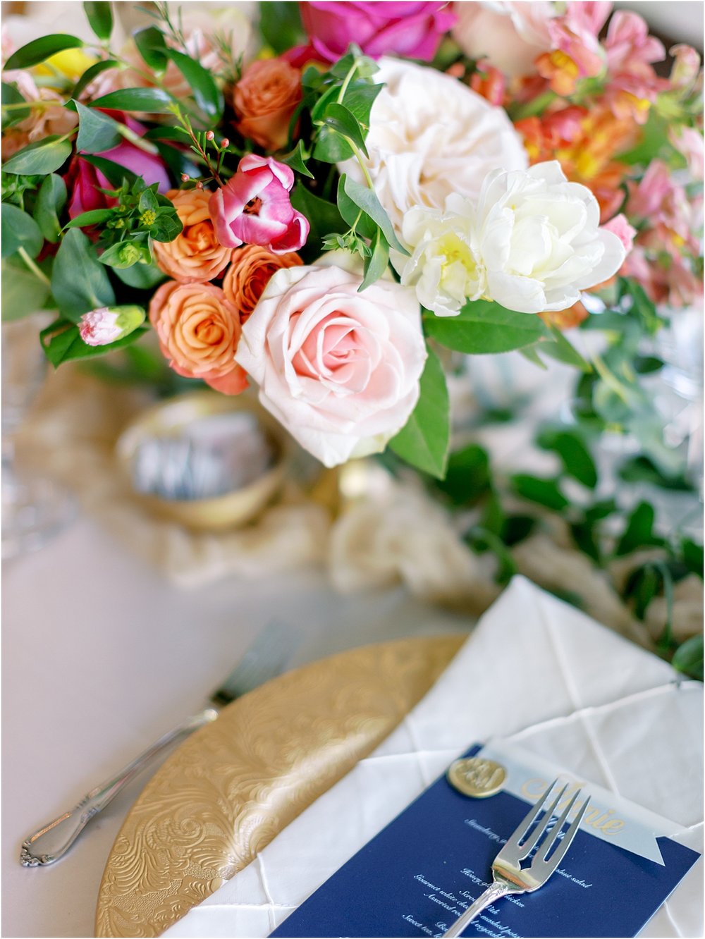 Pinks and oranges wedding reception table bouquet