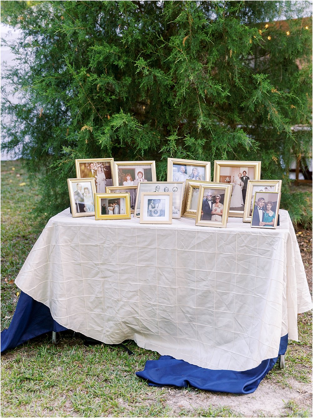 Wedding memory table with framed pictures