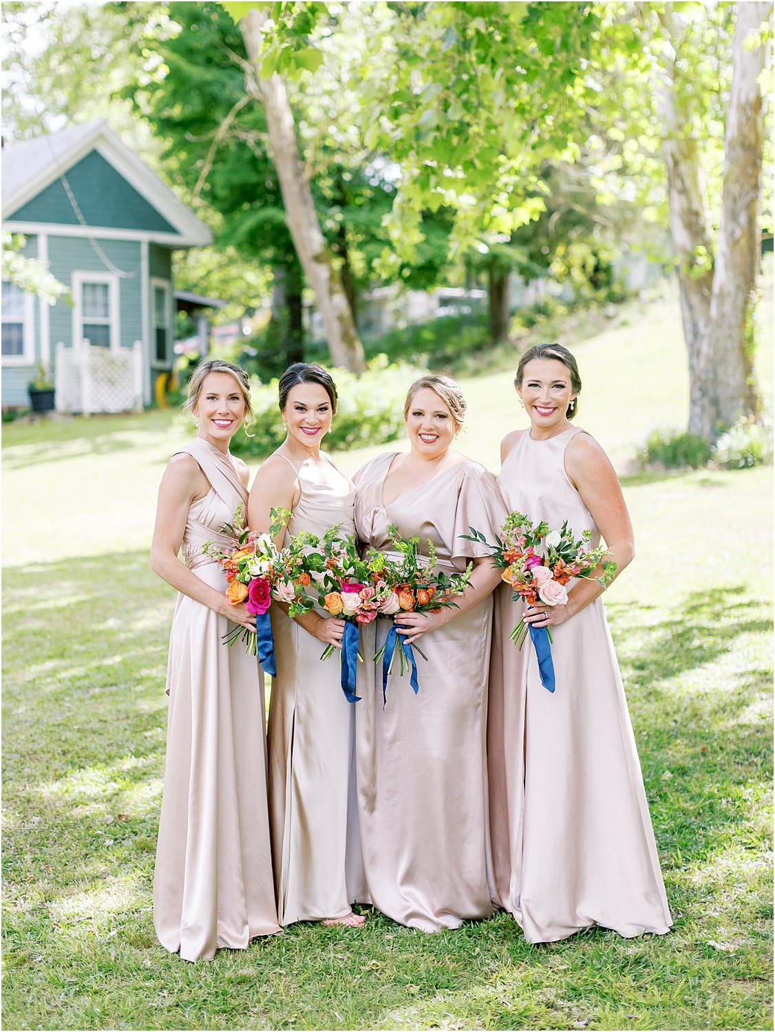 Blush neutral bridesmaid dresses with summer pops of color