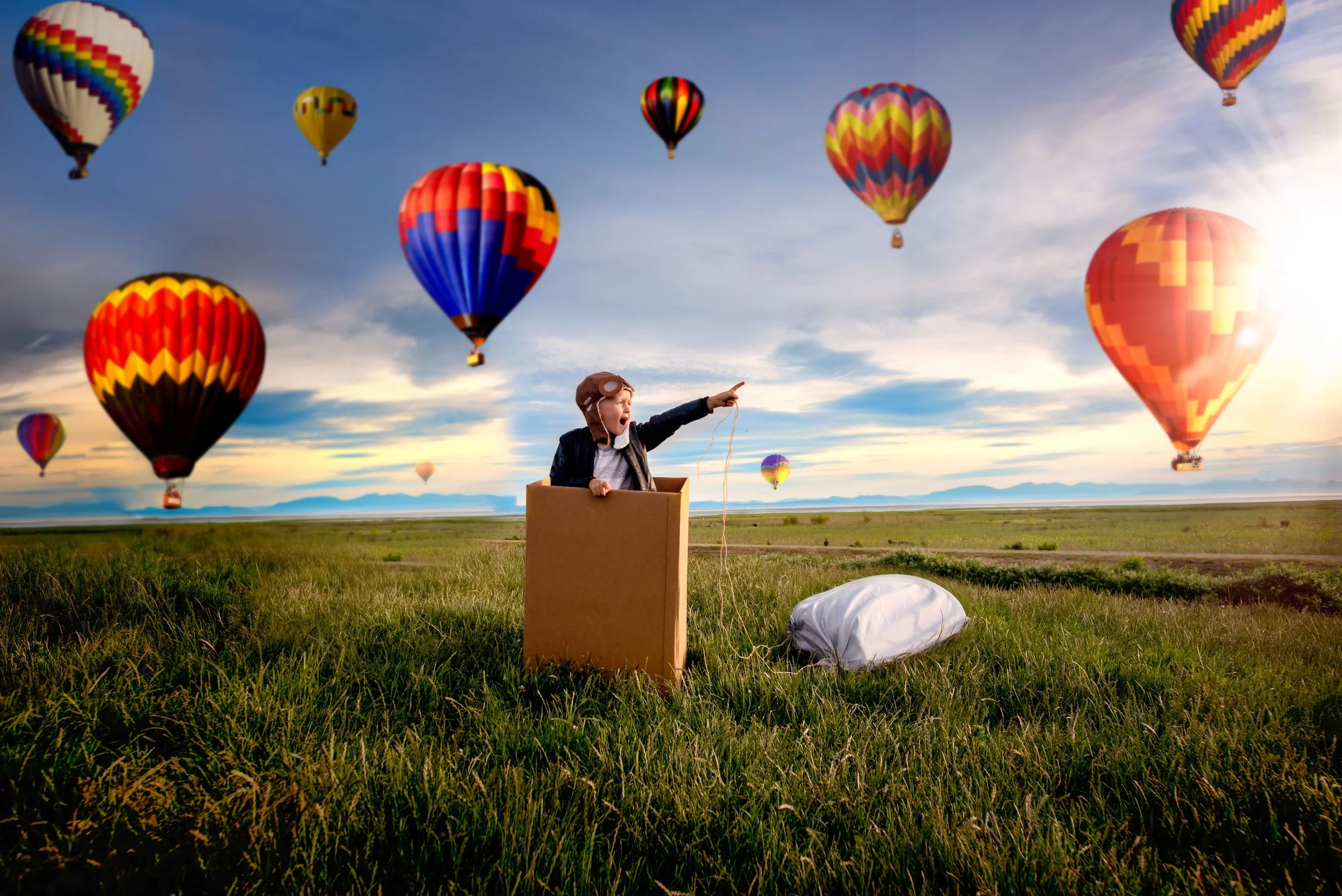 calgary children photographer boy flying pretend hot air balloon.jpg