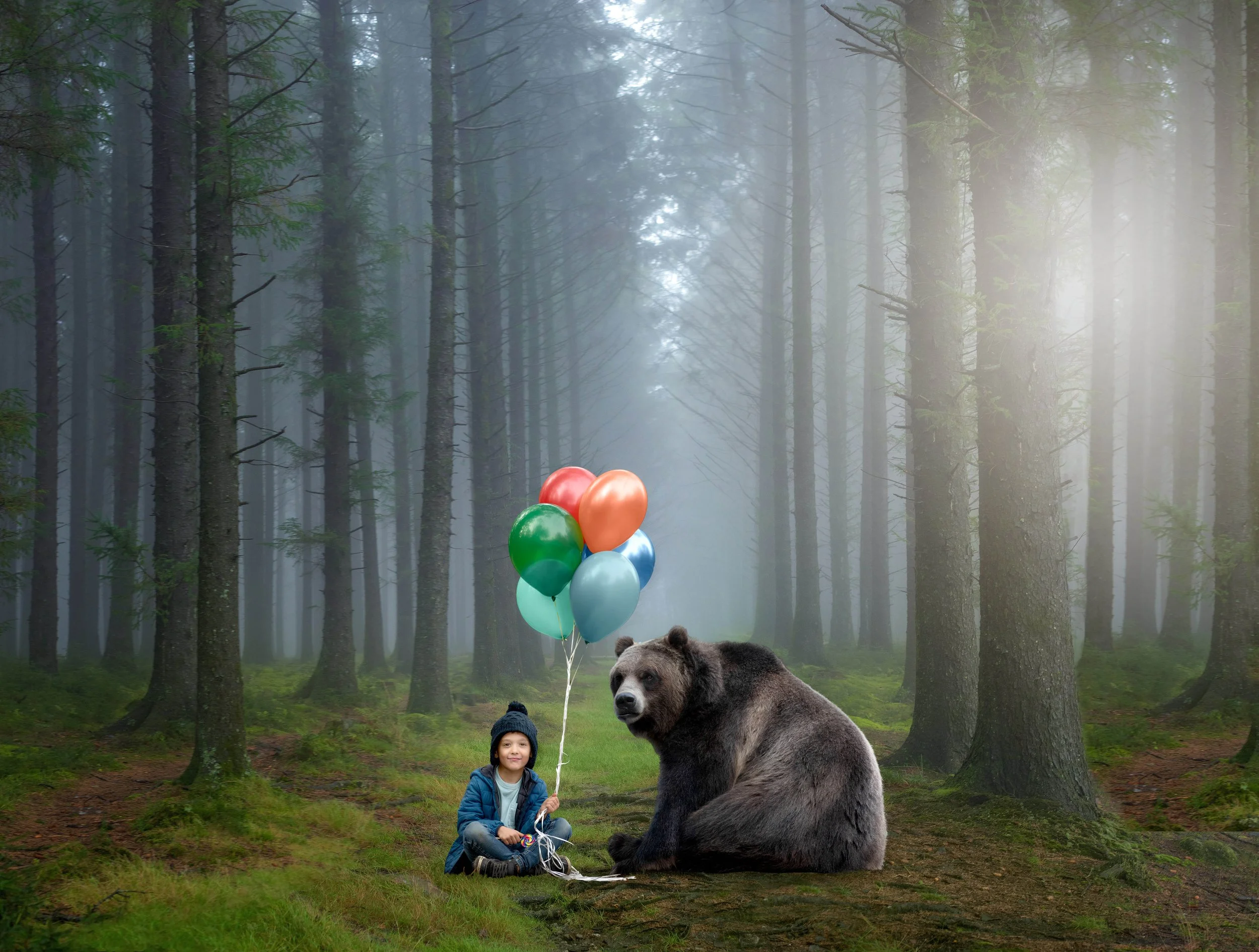 Calgary family photographer Boy in the woods holding balloons and sitting next to bear copy.jpg