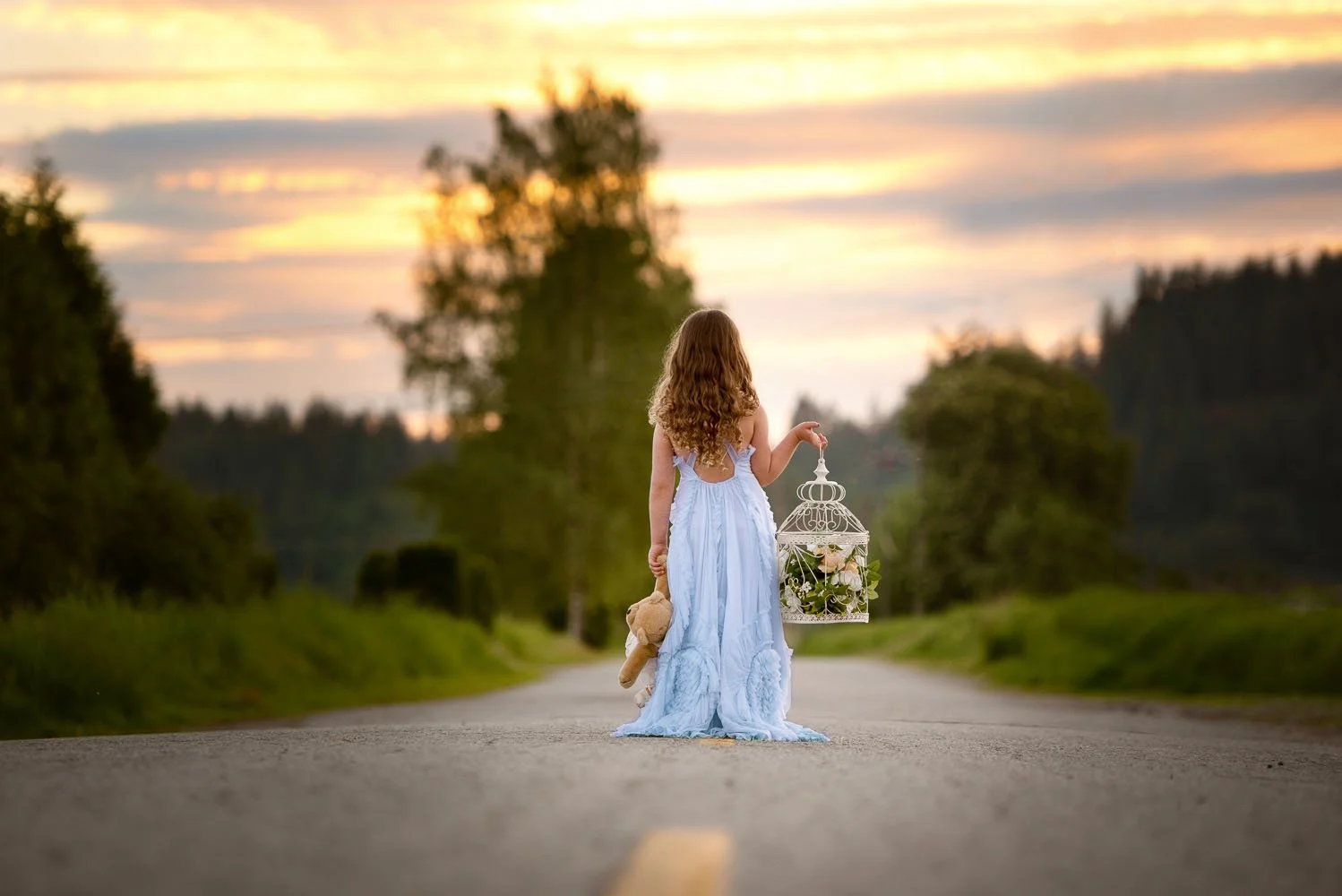 calgary children photographer Girl in blue dress in the road.jpg