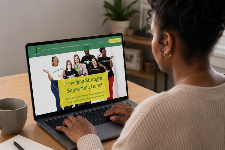 Prospective client viewing the Yellow Bird Counseling website on a laptop
