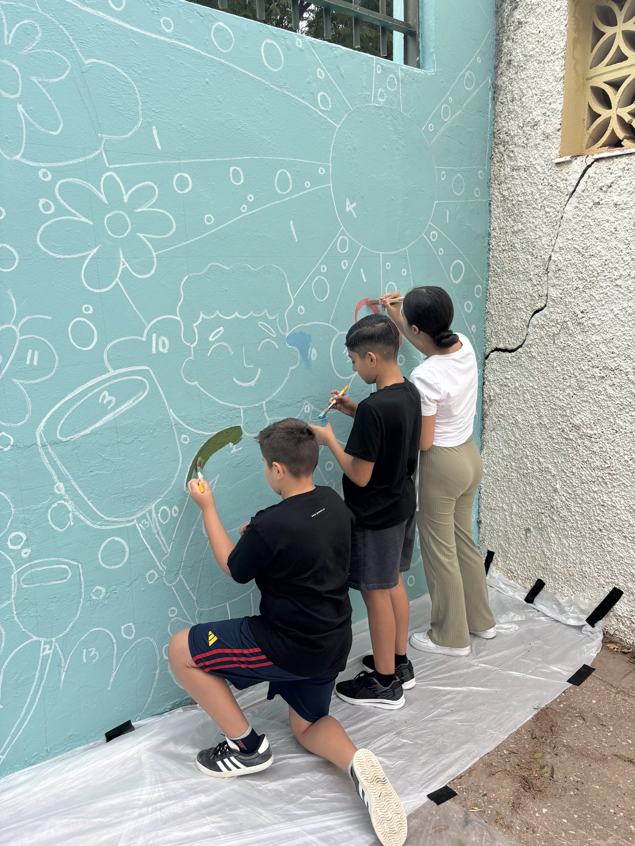 Over the course of two days, we had groups of 4th-, 5th-, and 6th-graders painting the mural. To keep things organized, students chose a color and focused on just those areas. Since we did not have the original wall color, we were unable to test what