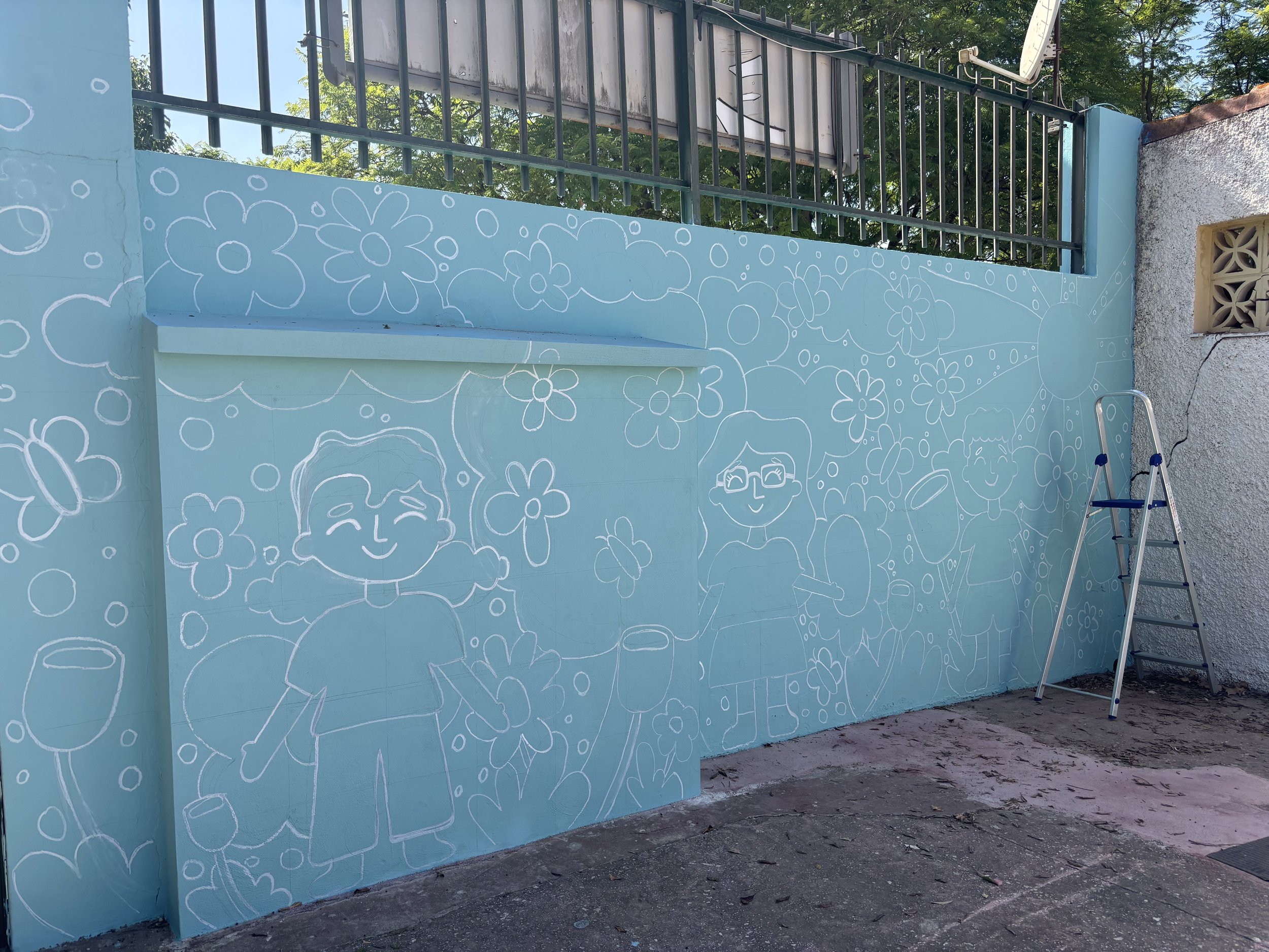 The only issue with using the chalk pens is that if you are doing the outline and coming back to paint the mural another day, make sure you check the weather, because if it rains and your wall is exposed to the elements, the chalk will wash away. You