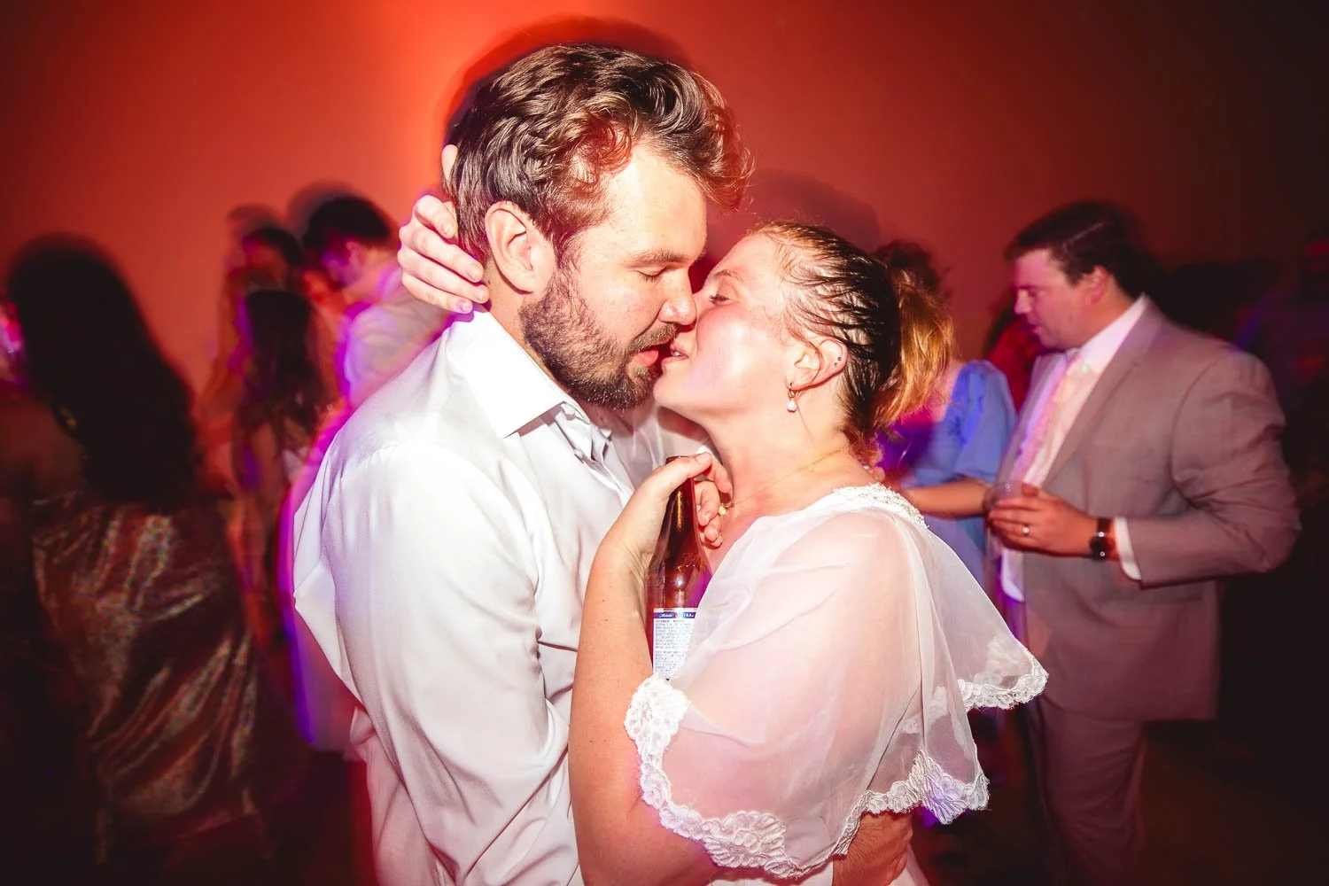 bride and groom making out on the wedding reception dance floor - josh and lindsey photo