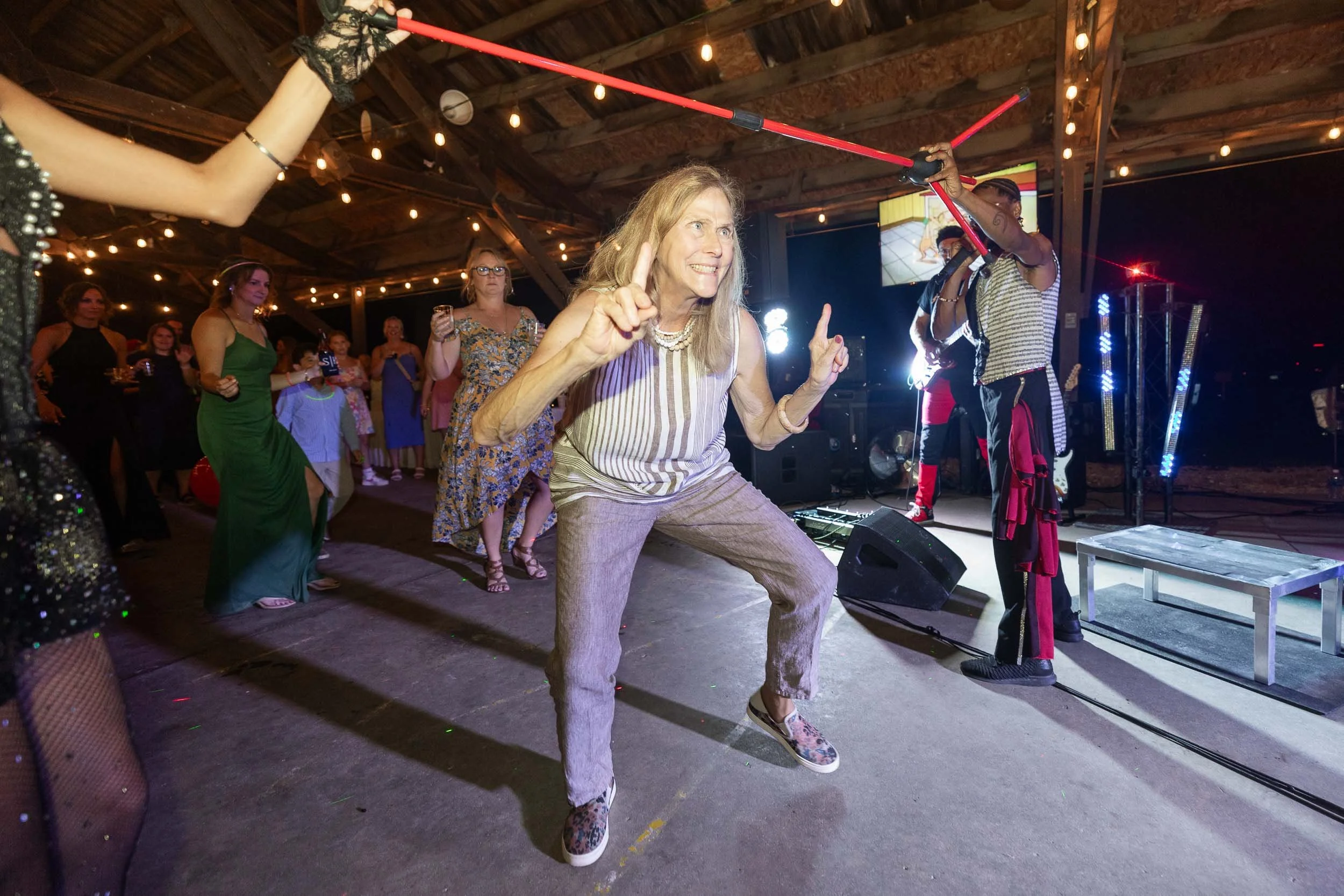 wedding guests playing limbo at wedding reception_Western Illinois