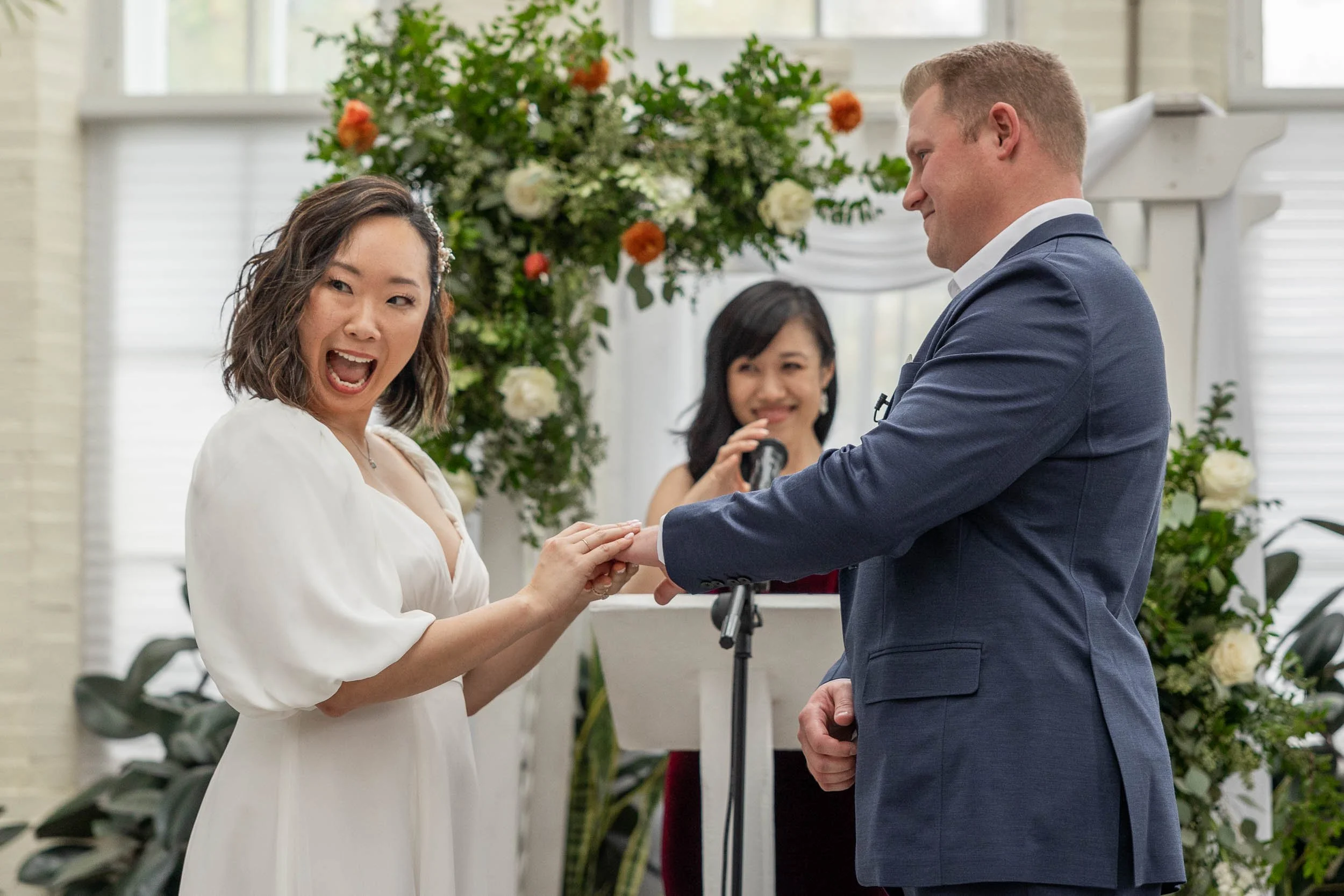 groom-puts-ring-on-bride-wedding-photography.jpg