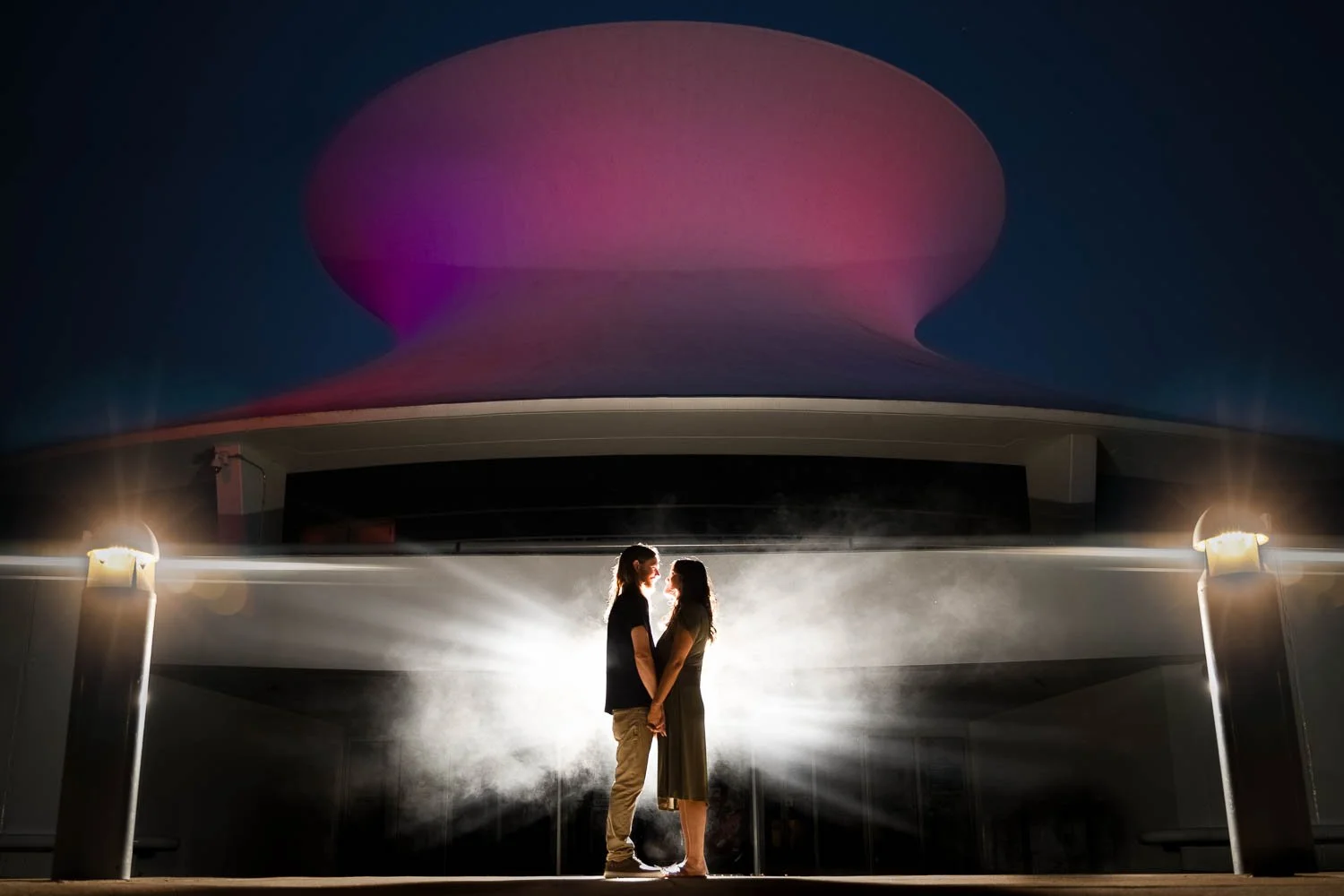 couple holding hands during dramatic engagement session at the science center-josh and lindsey photo