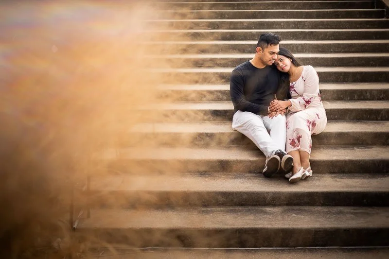couple snuggling on the stairs of the world's fair pavilion in saint louis missouri