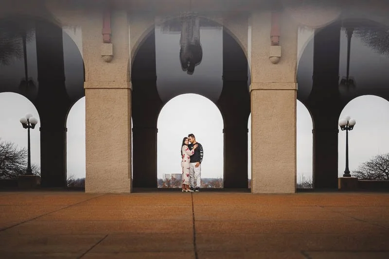 couple standing between two pillars at st louis worlds fair pavilion-josh and lindsey photo