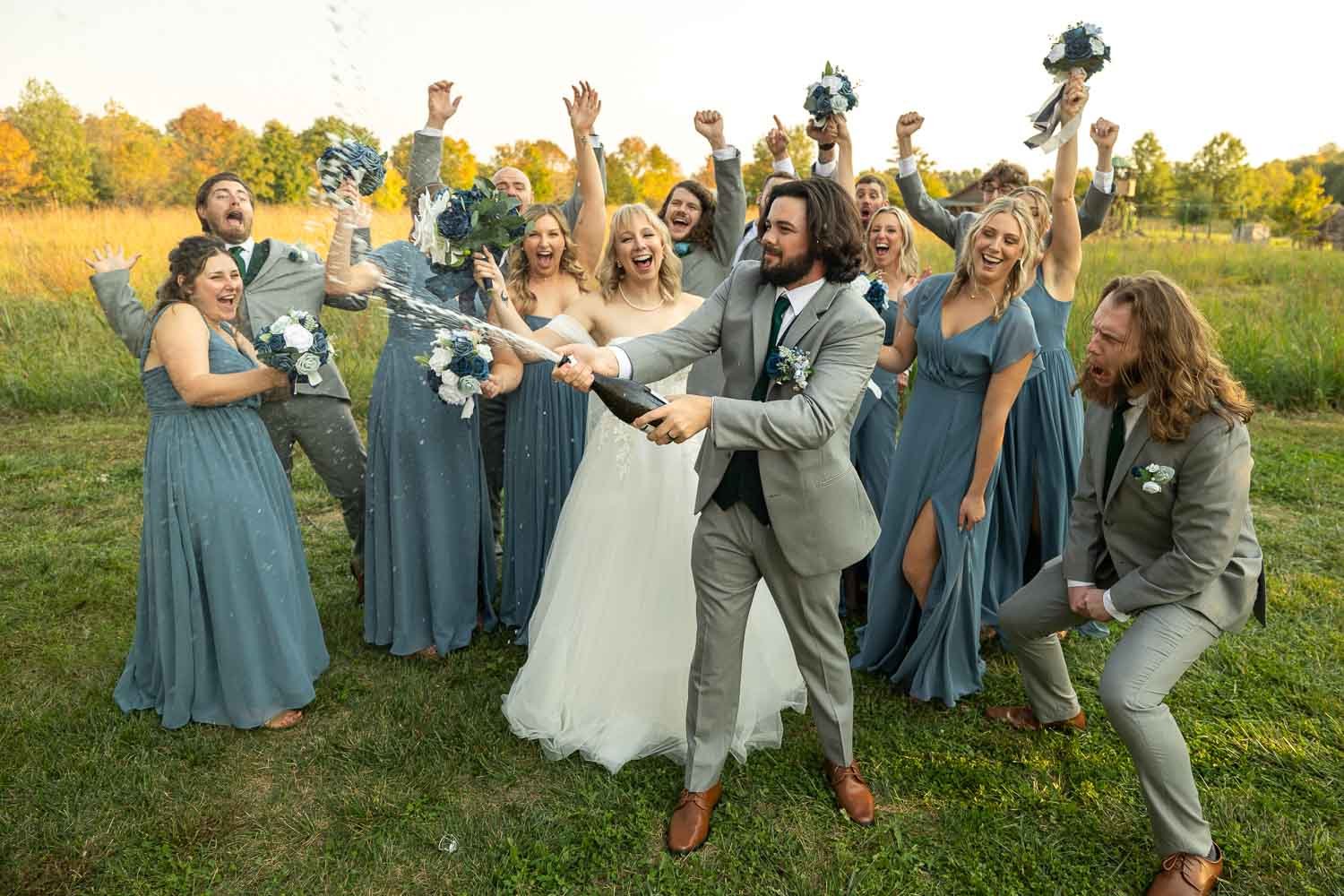 bridal party popping champagne-Illinois wedding photographer