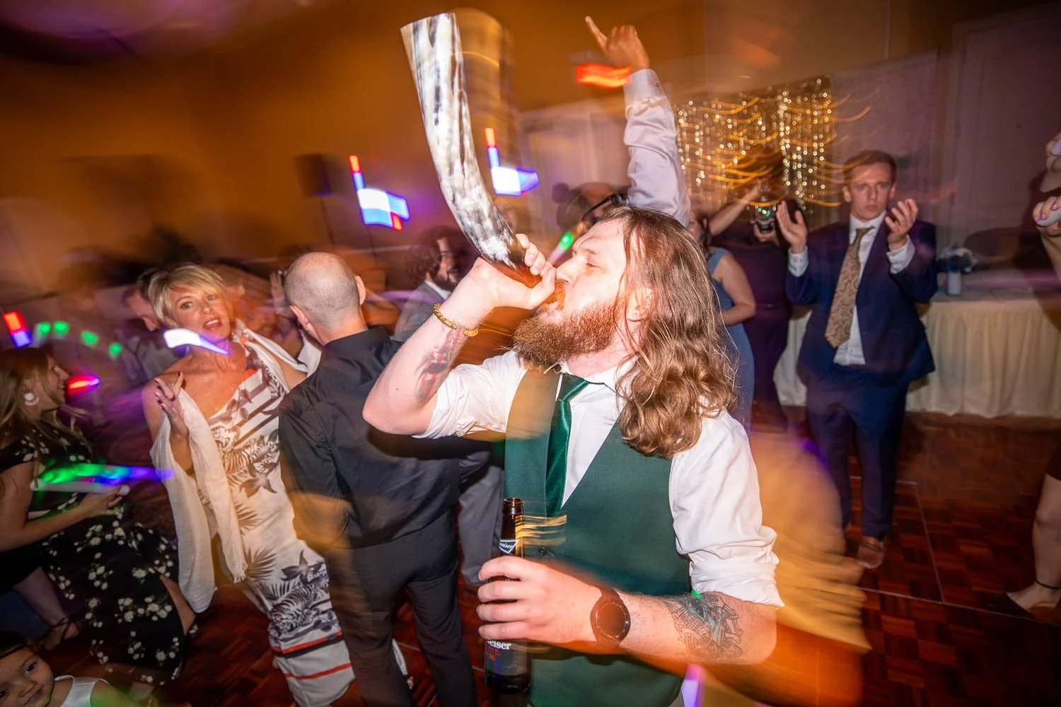 groomsman blowing trumpet on wedding reception dance floor-bride crying during father daughter dance-illinois wedding photographer