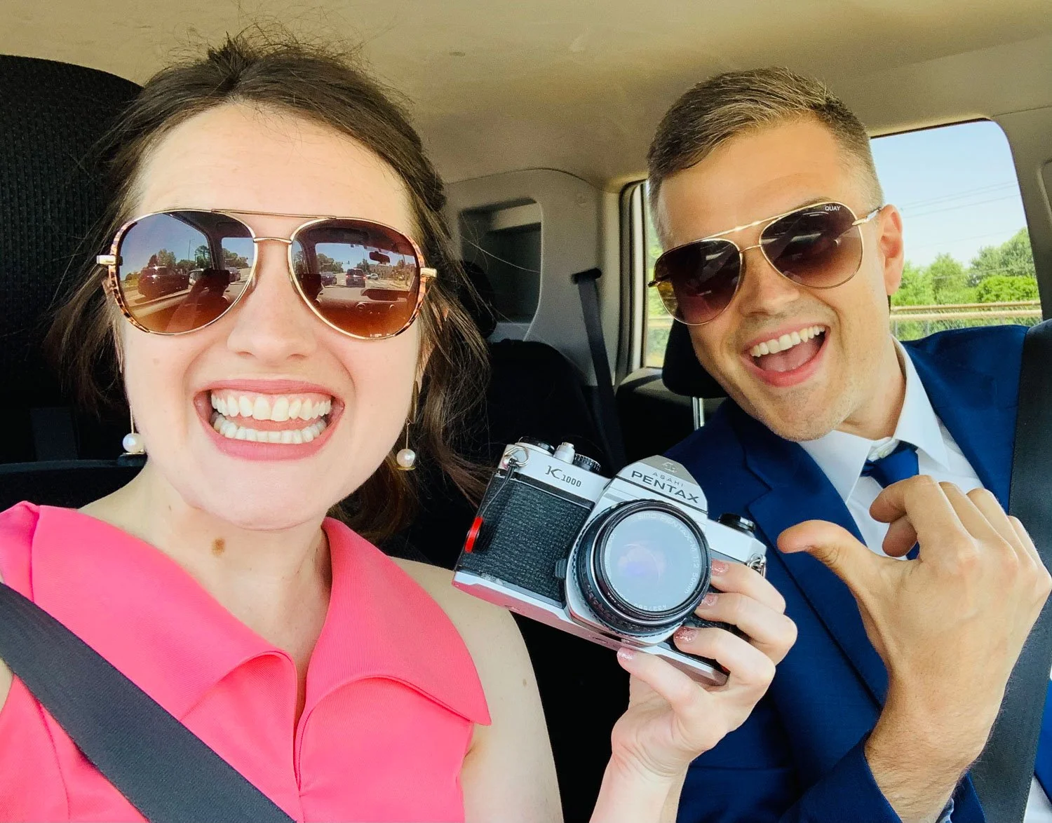 st louis wedding photographers laughing with a film camera