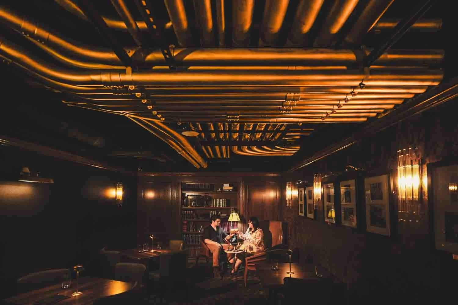 couple having a drink together celebrating their engagement-city foundry engagement photography