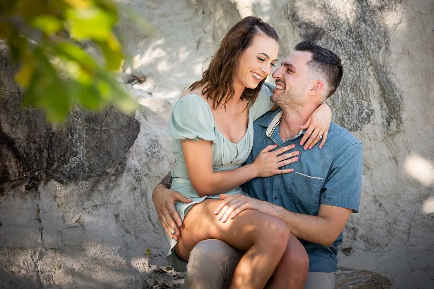 woman sitting on man's lap laughing-josh and lindsey photo