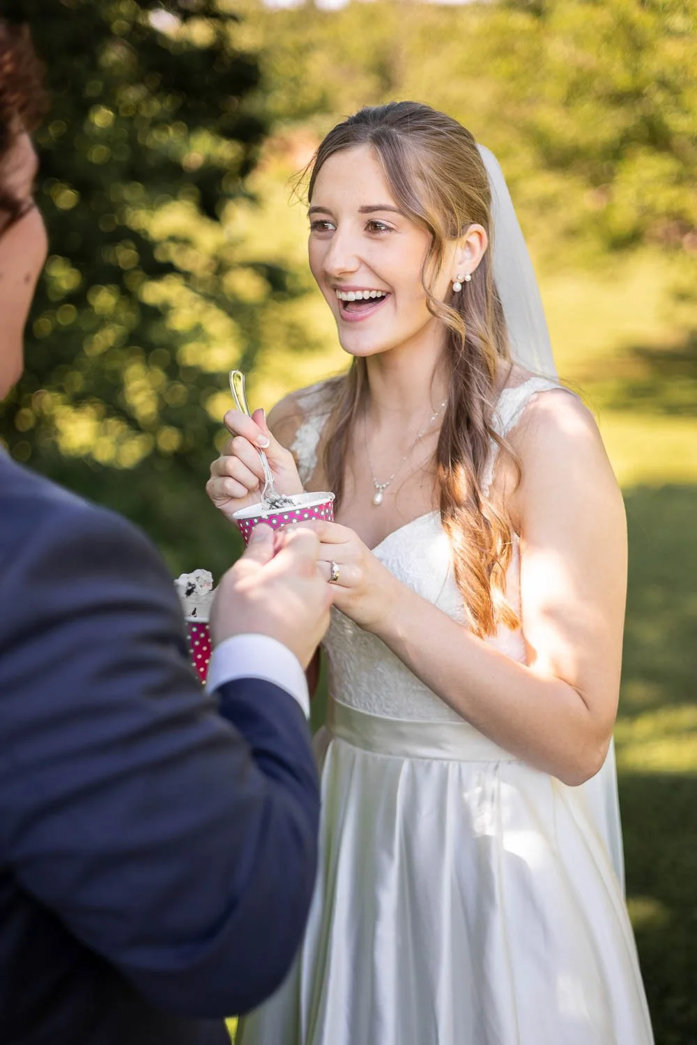 bride and groom share ice cream in washington state park-josh and lindsey photo