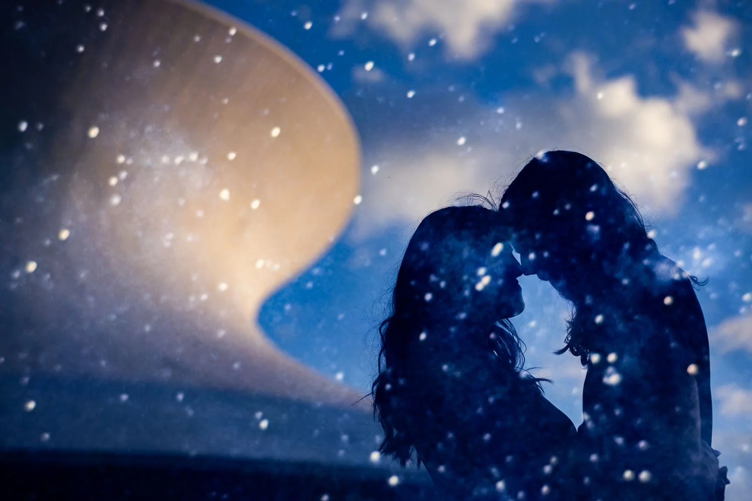 couple holding each other in front of the st louis science center with stars covering them-josh and lindsey photo