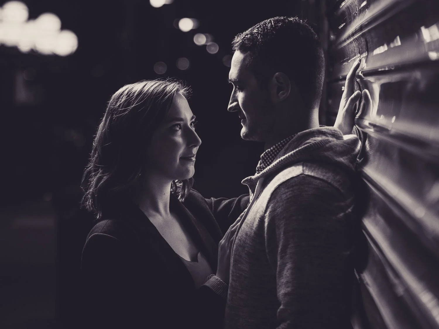 woman flirting with man during engagement session-saint louis union station engagement session