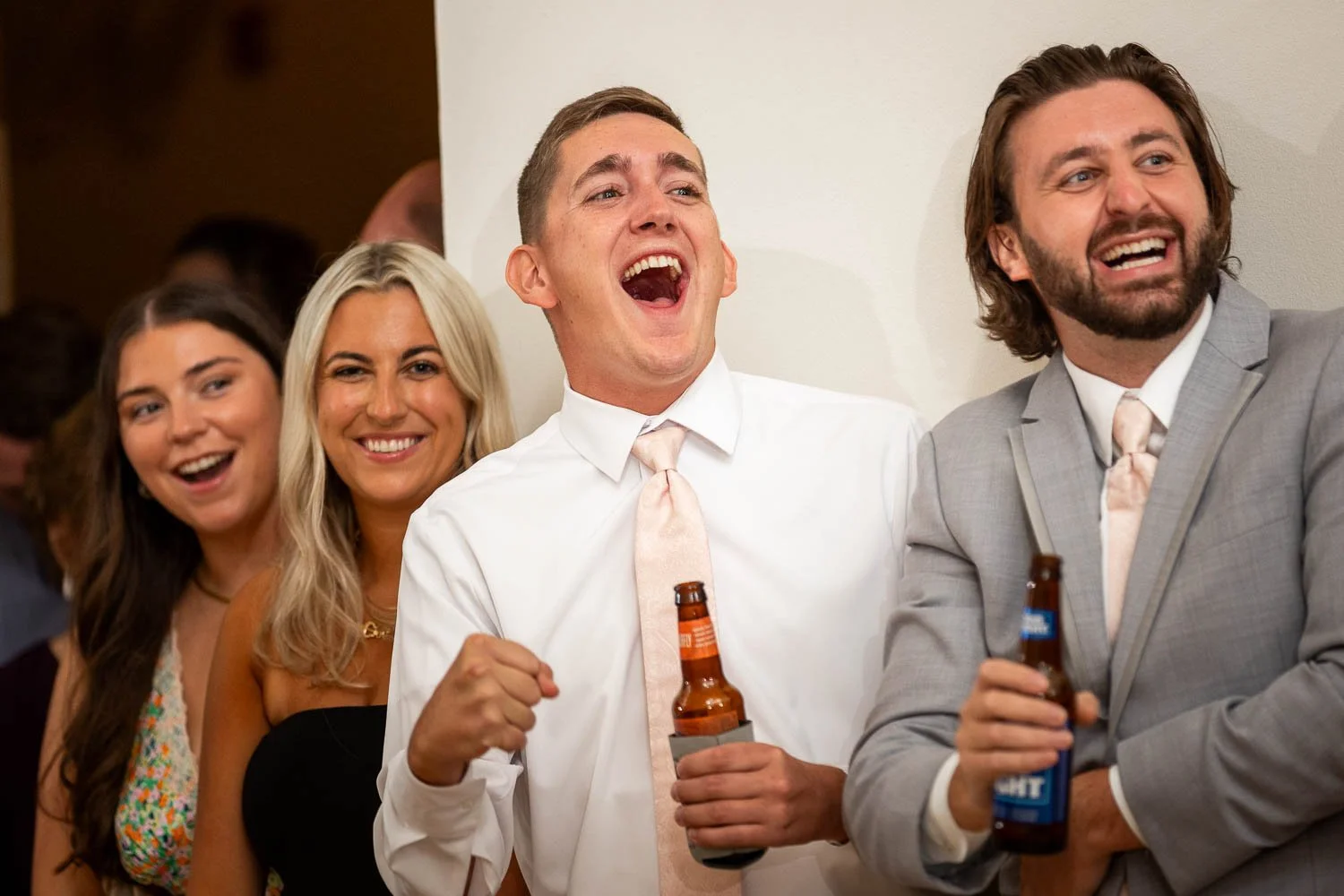 wedding guest celebrating with bride and groom during reception at the boo cat club
