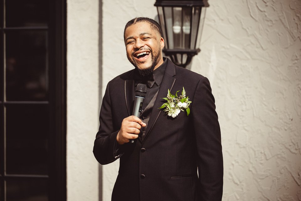 best man giving a speech at wedding reception