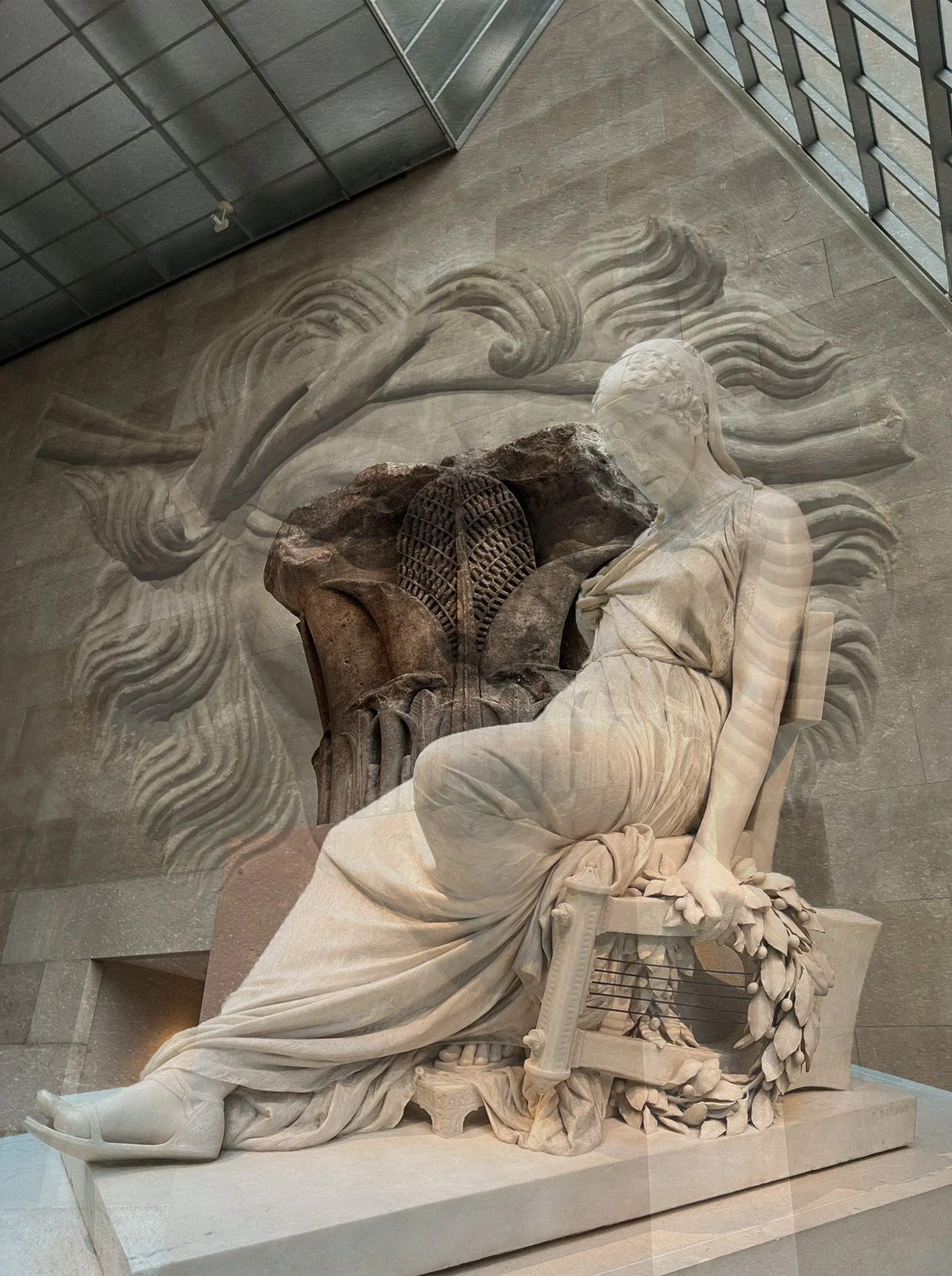overlayed images of stone sculptures, a goddess, a face, a column