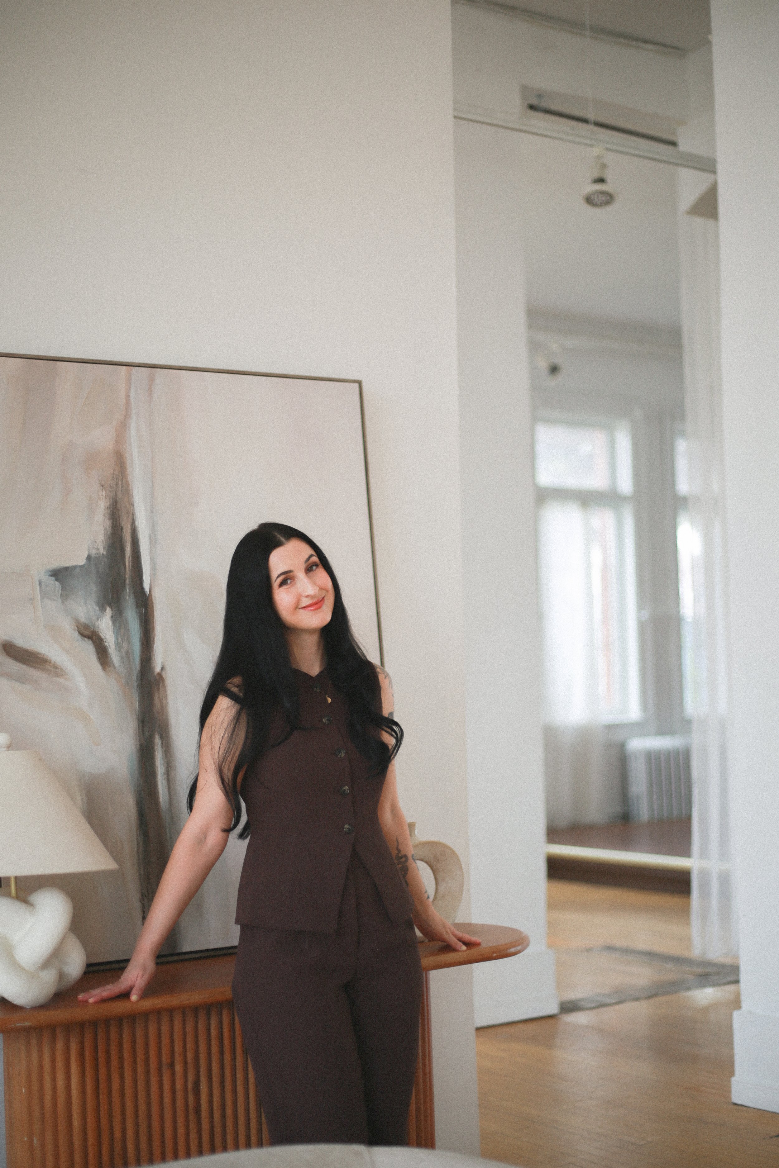 Woman smiling in brown suit