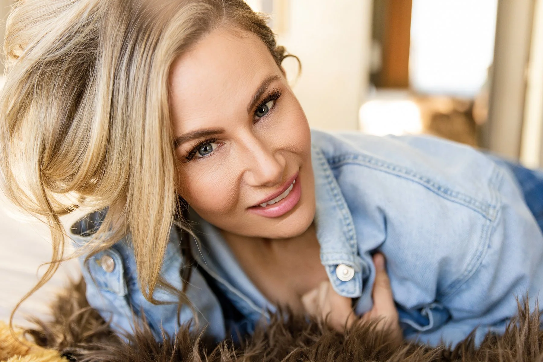 up close photo of blonde women with blue eyes