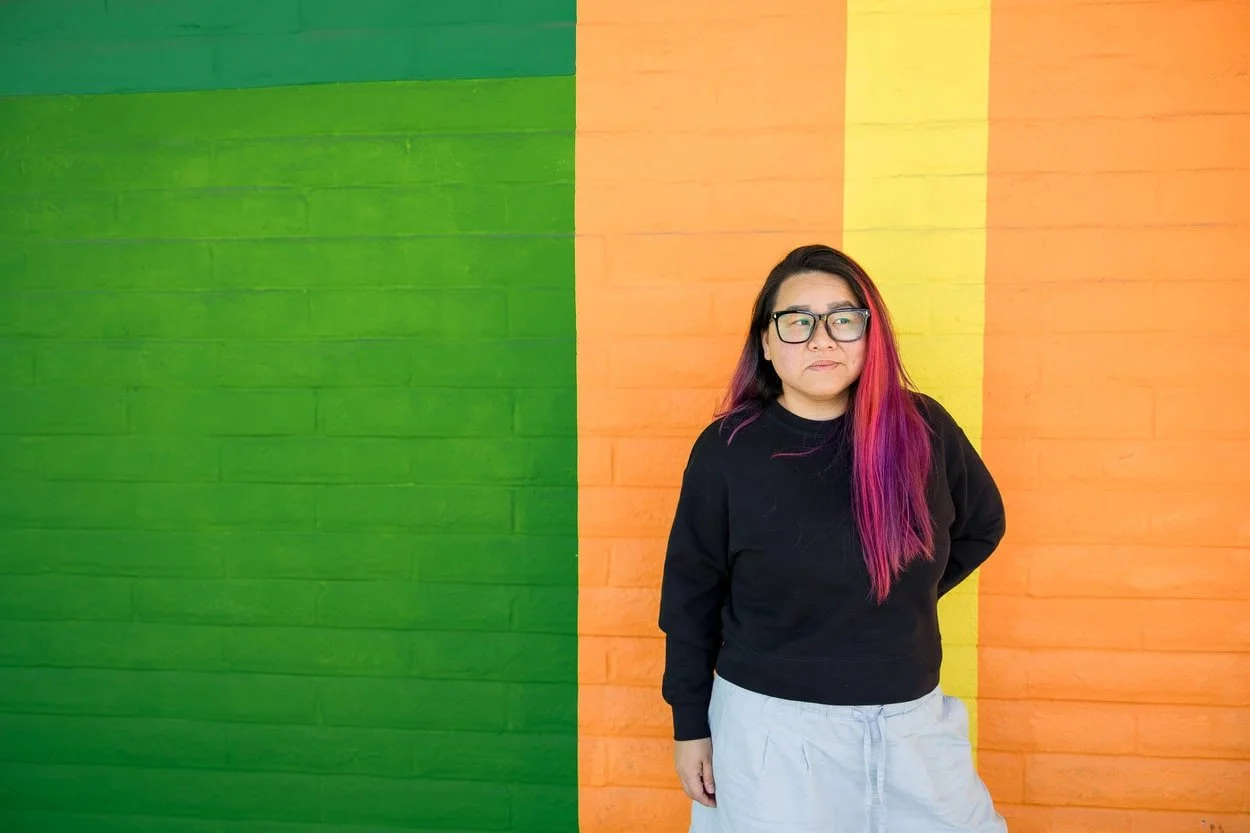 The image of LGBTQ BIPOC youth therapist Burnaby posing to the camera, looking pensive to accompany a blog post about neuroqueer double masking burnout