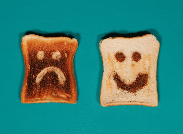 The image of a burnt toast and smiley toast side by side to accompany a blog post about neuroqueer double masking burnout