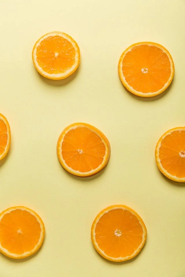 The image of a bunch of orange slices to accompany a blog post about why do I lose track of time so easily for ADHD neurodivergent folx