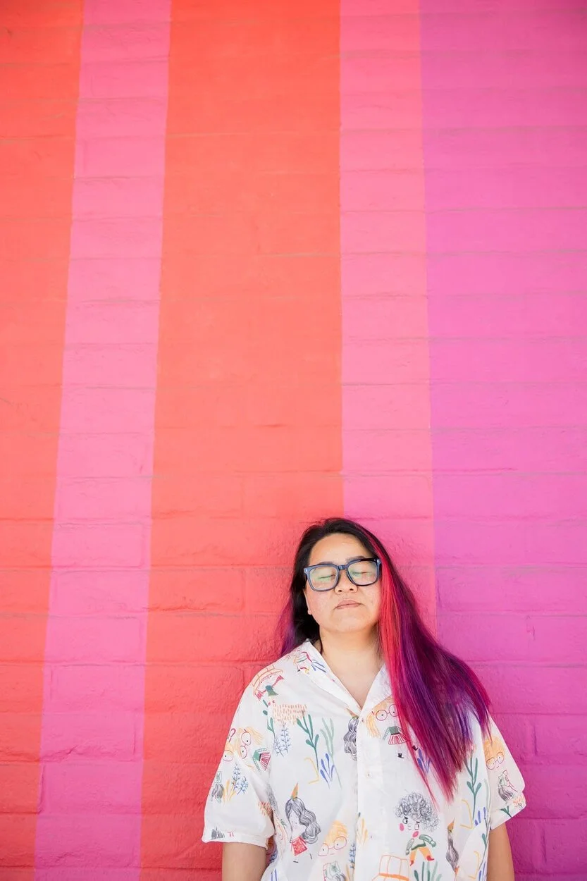 The image of LGBTQ BIPOC transgender counsellor in Burnaby posing to the camera, looking pensive to accompany a blog post about whether am I trans enough. The article is written by an LGBTQ therapist Burnaby running a counselling in Burnaby