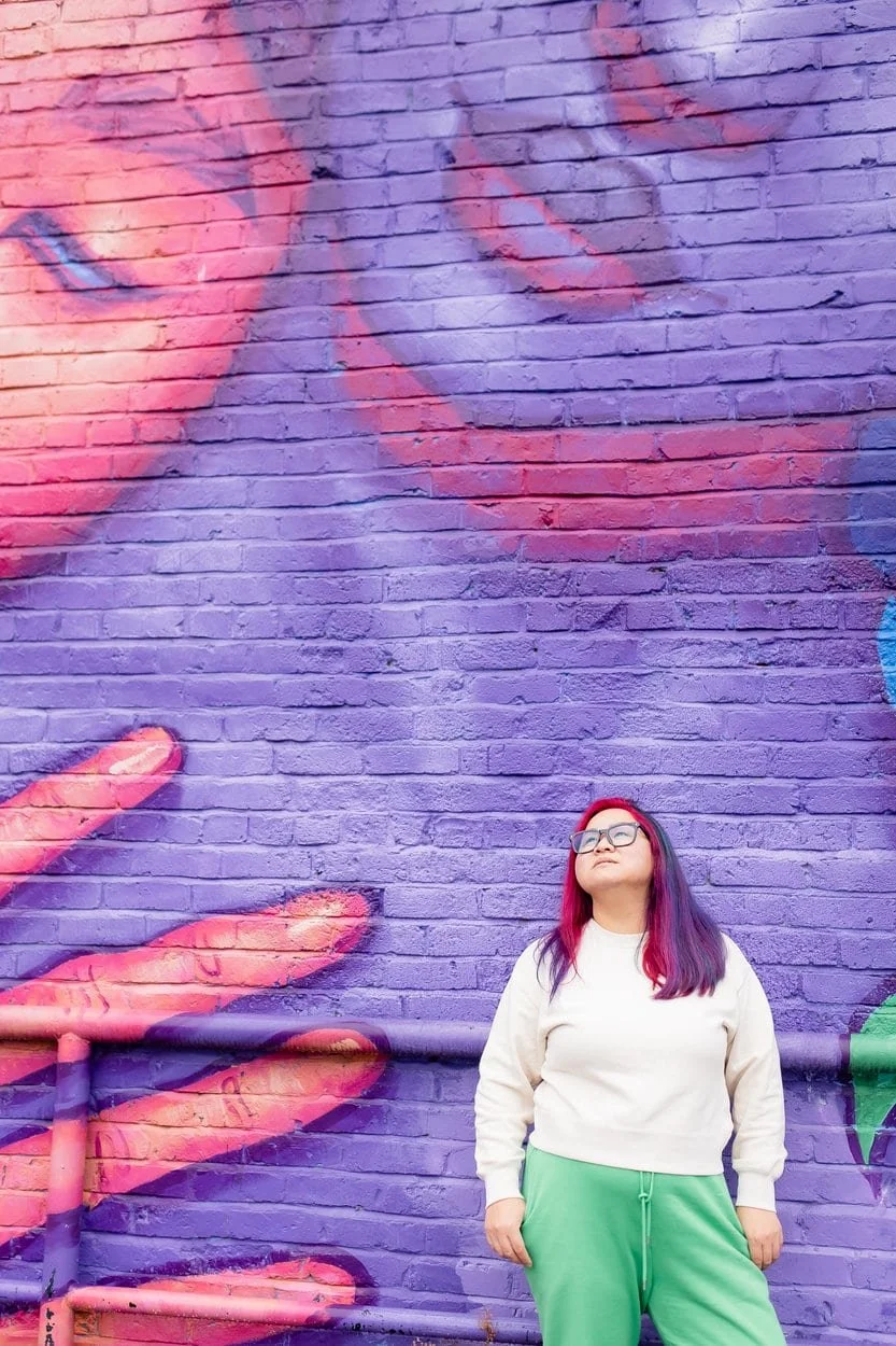 The image of LGBTQ BIPOC transgender counsellor in Burnaby posing to the camera, looking pensive to accompany a blog post about whether am I trans enough. The article is written by an LGBTQ therapist Burnaby running a counselling in Burnaby