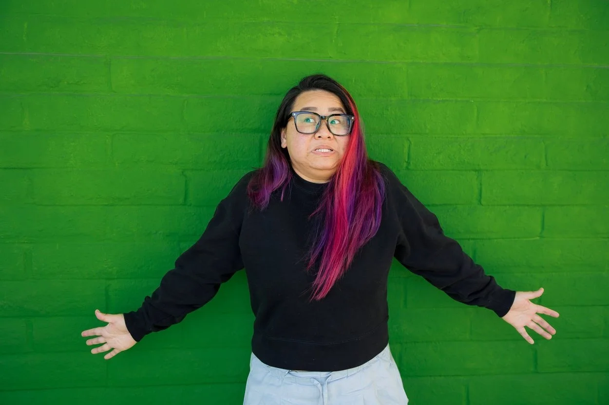 The image of LGBTQ youth BIPOC therapist Burnaby posing to the camera to accompany a blog post about genderqueer discovery