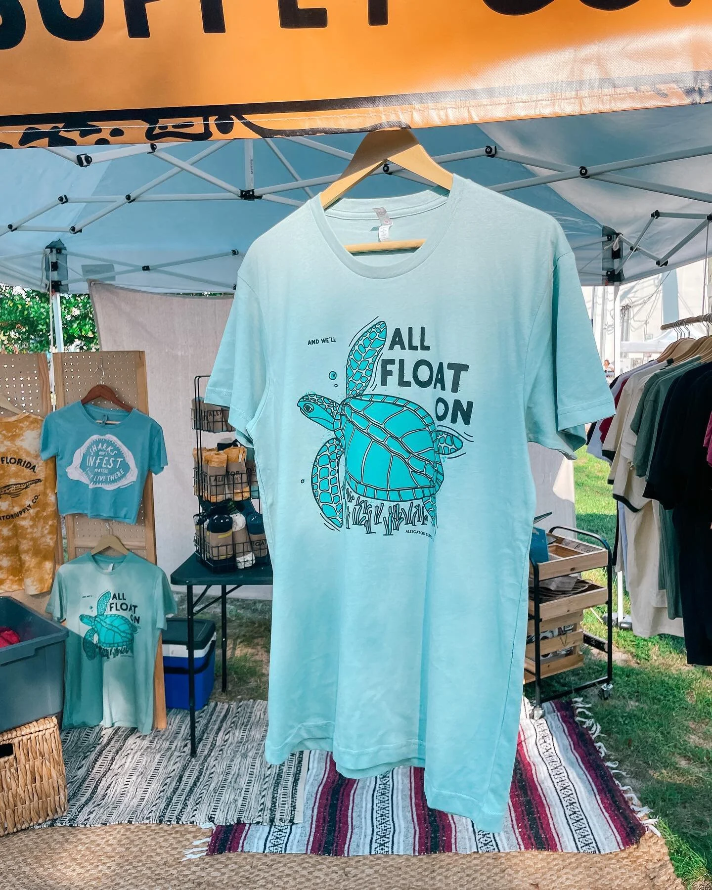 And We&rsquo;ll All Float On. Now available on sea foam green! Get yours today at the Panama City Farmers Market until 1.
@panamacityflfarmersmarket 
#floridaartist #floridaapparel #seaturtleconservation #seaturtle #greenseaturtle #modestmouse #float