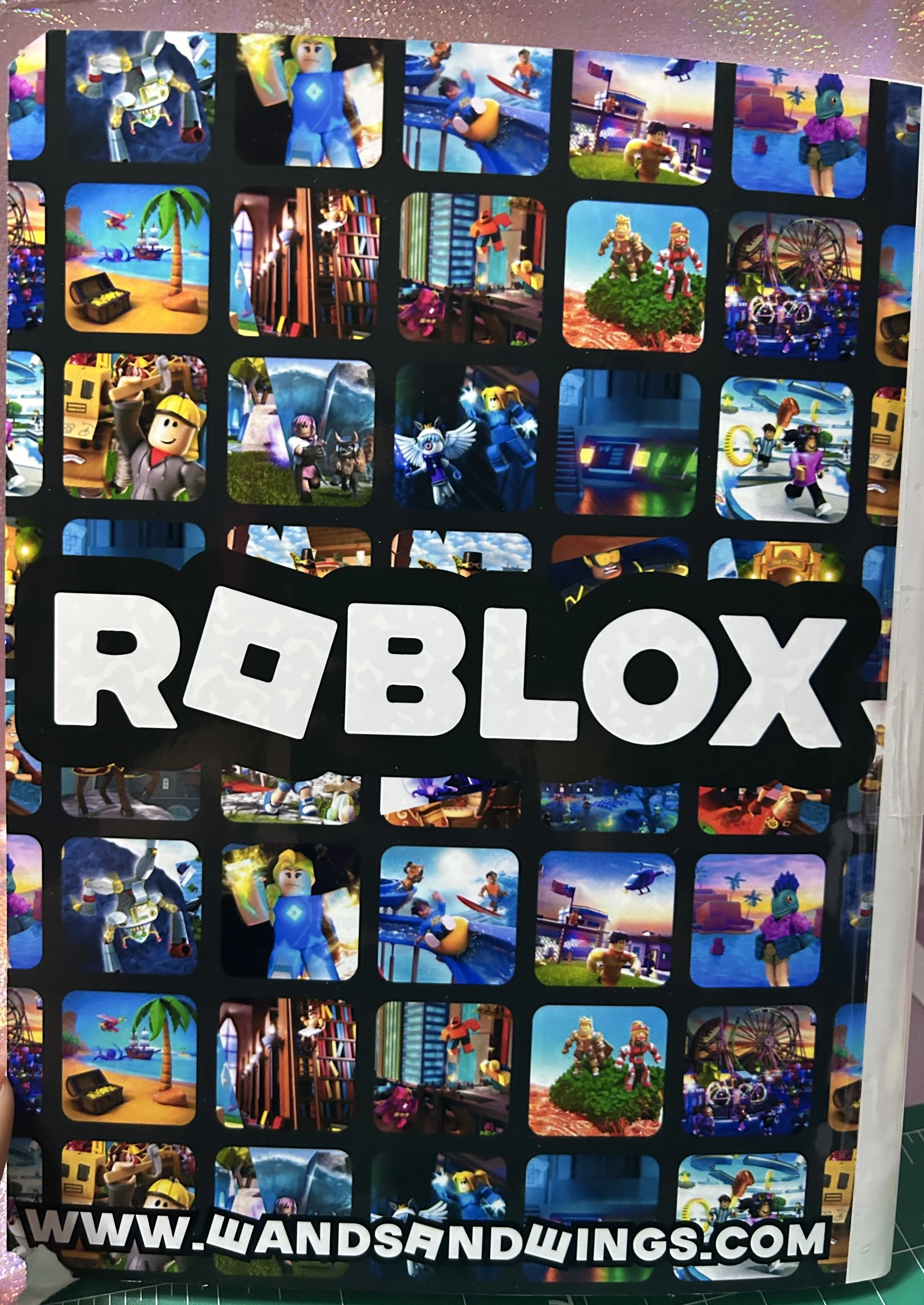 Collage of various Roblox game scenes featuring characters and environments. The word "Roblox" is prominently displayed in large white letters in the center. The background shows a collection of colorful images, showcasing different adventures and ac