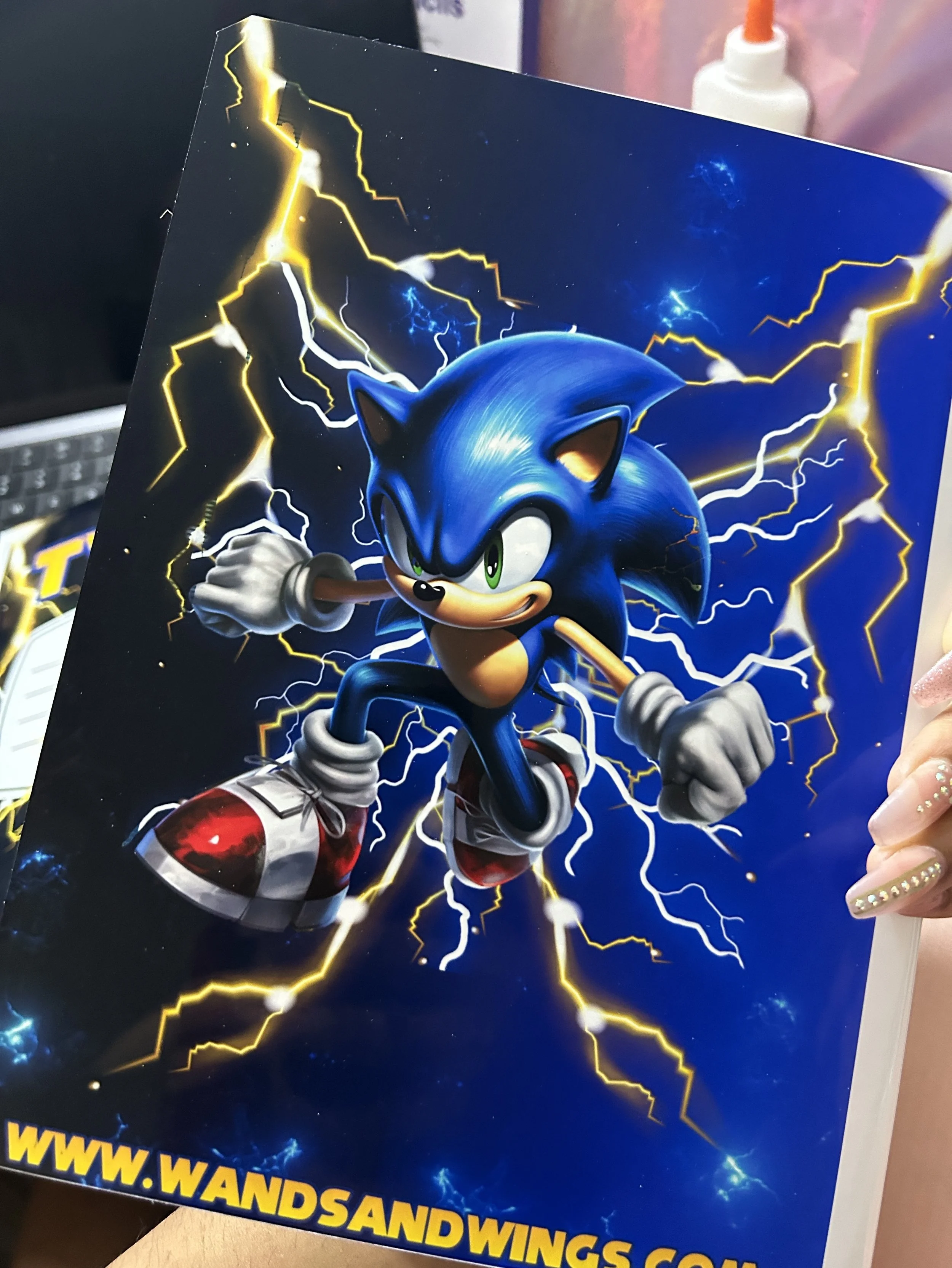 A poster featuring a blue animated character with lightning in the background.