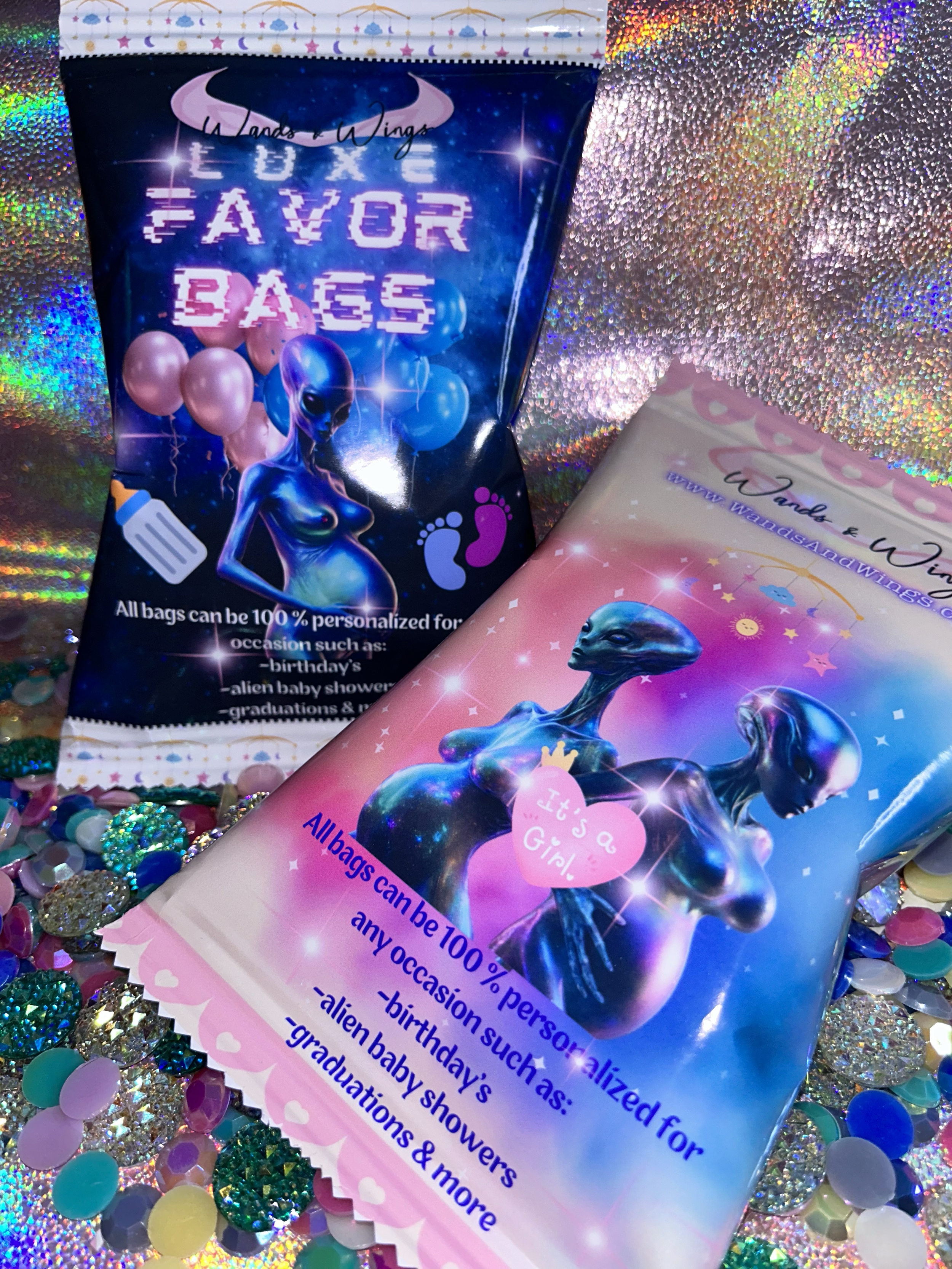 Colorful product packaging for "Favor Bags" featuring alien-themed designs, including graphics of aliens and elements suggesting personalization for events like baby showers, birthdays, and graduations. Glittery, iridescent surfaces and multicolored 