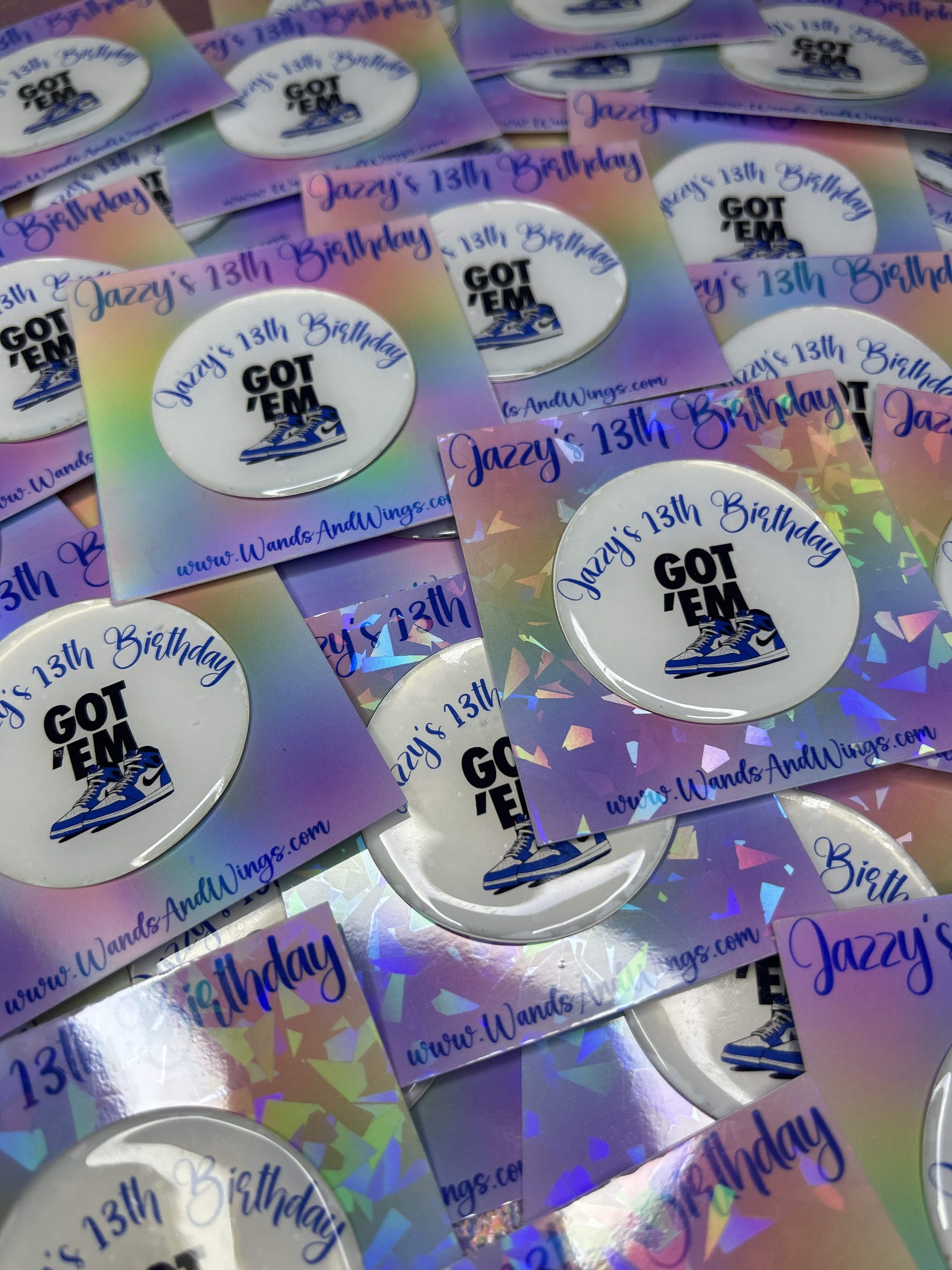 Collection of birthday badges with "Got 'Em" design featuring sneakers, celebrating Jazzy's 13th birthday, colorful holographic background.