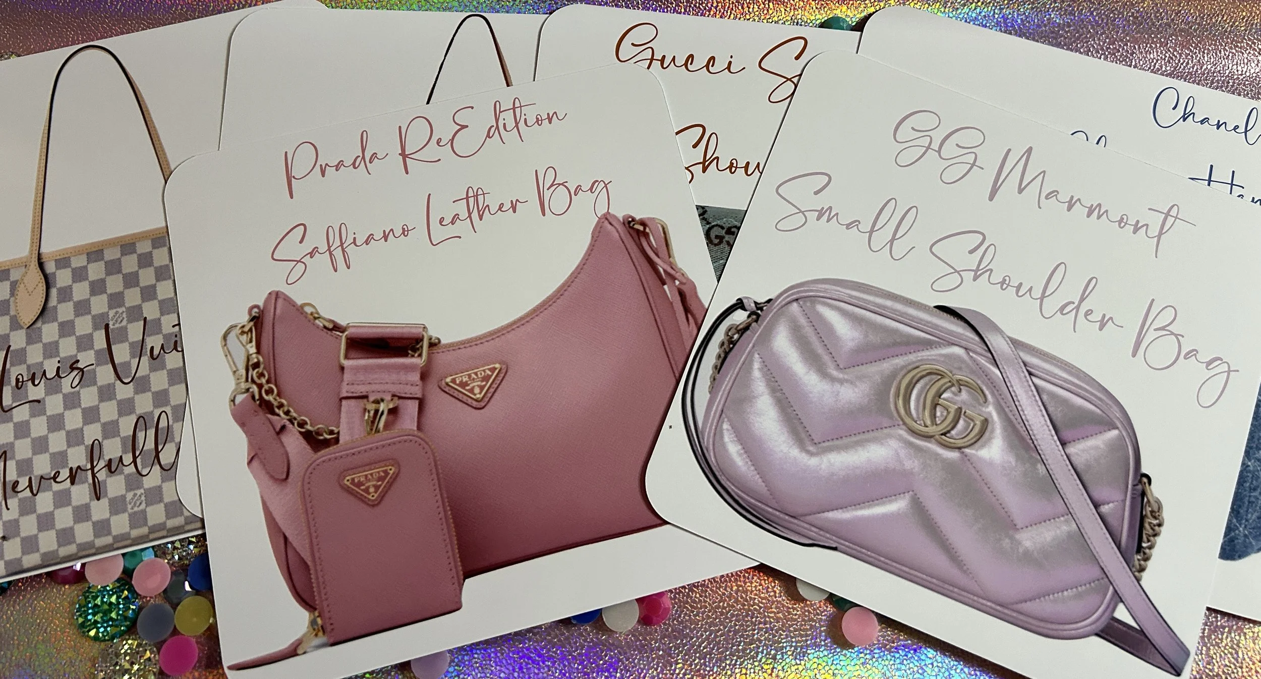 Collection of designer handbag cards, including Prada Saffiano Leather Bag and GG Marmont Small Shoulder Bag, displayed on a holographic surface.