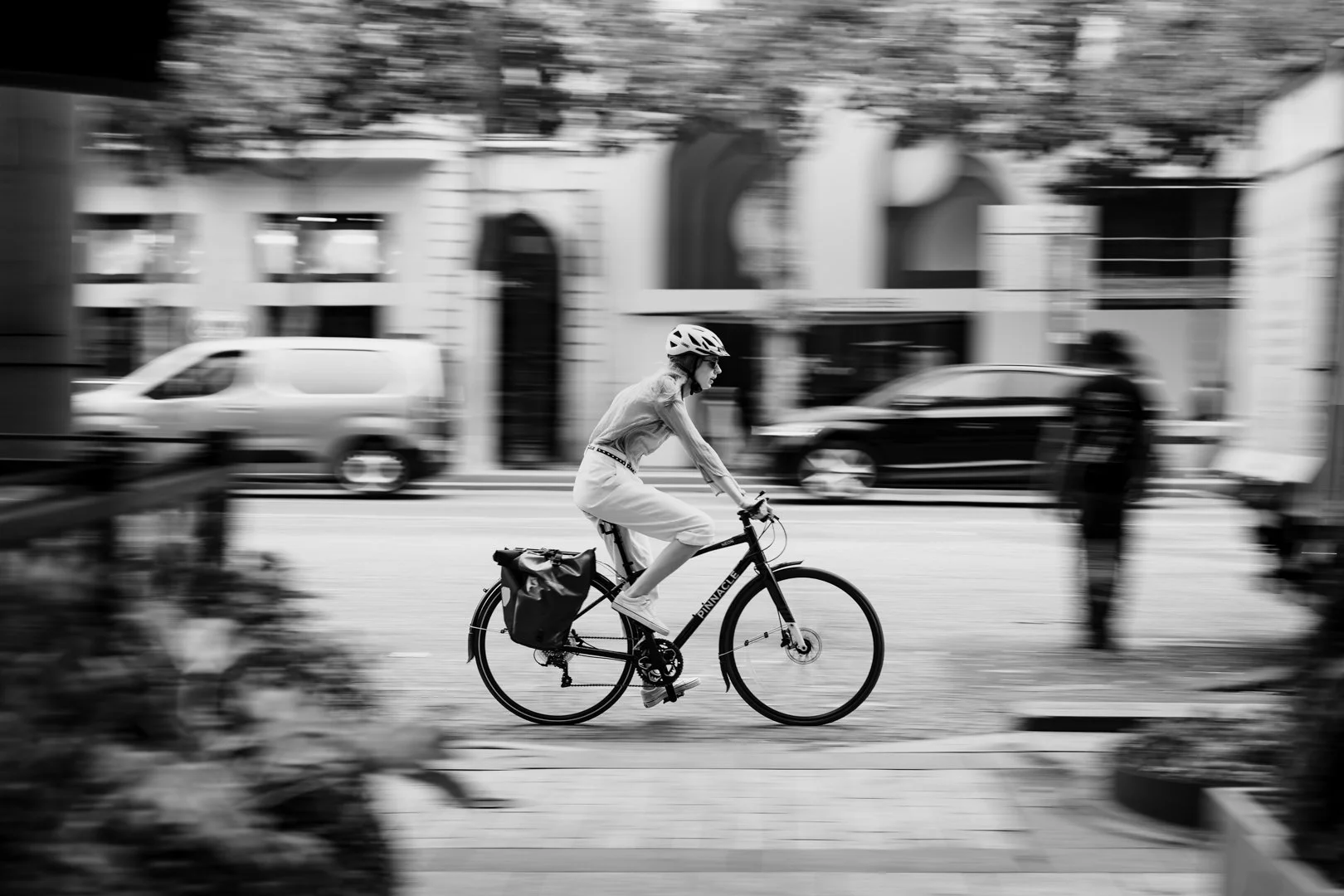 A French woman riding a bike in Paris, France.