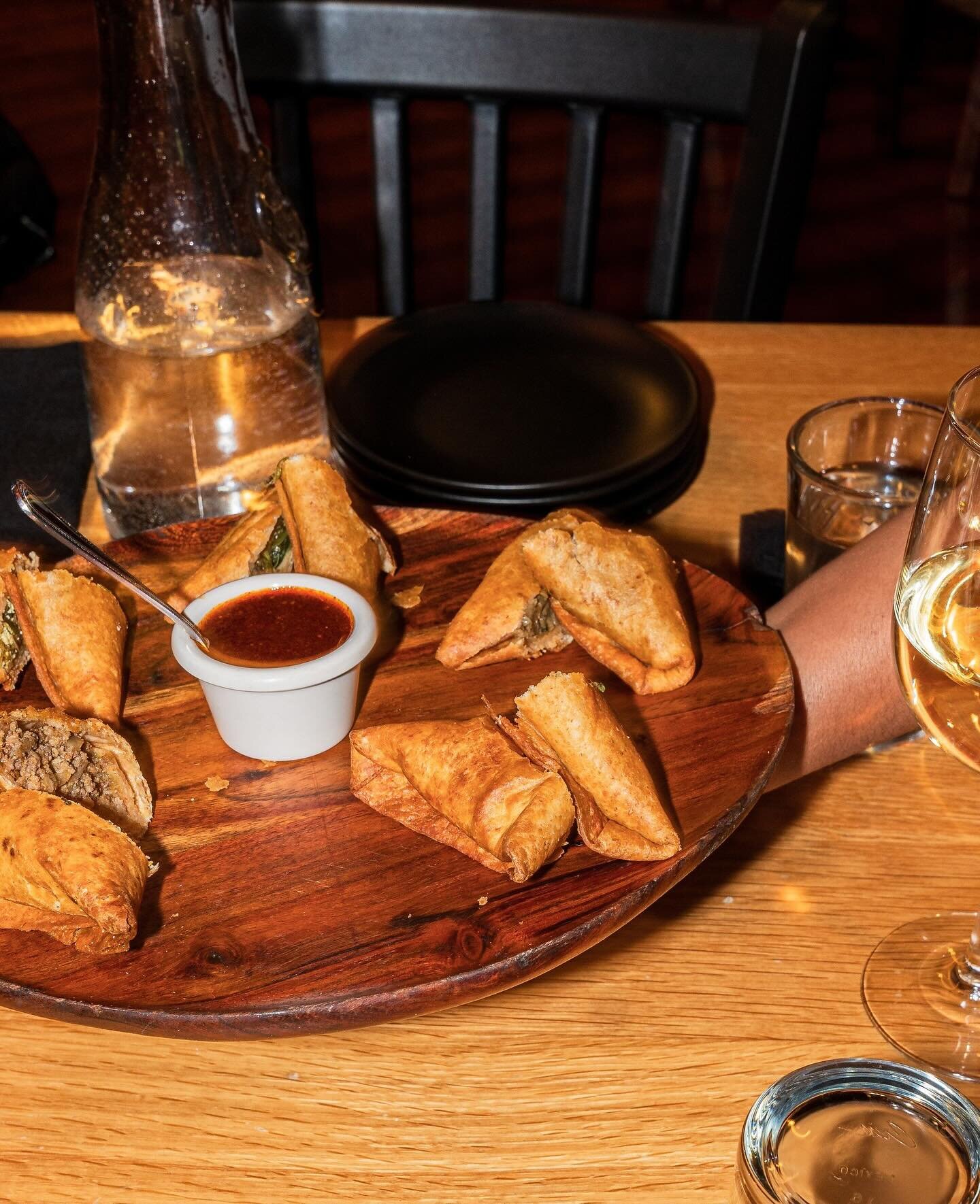 Have you tried our sambussas? Swipe to see how they&rsquo;re made 👀🤤⁠
⁠
SAMBUSSA SAMPLER ⁠
A combination of all 5 of our sambussa options! Sambussas are fried dumplings with various fillings, served with our house-made sweet and spicy honey awaze s