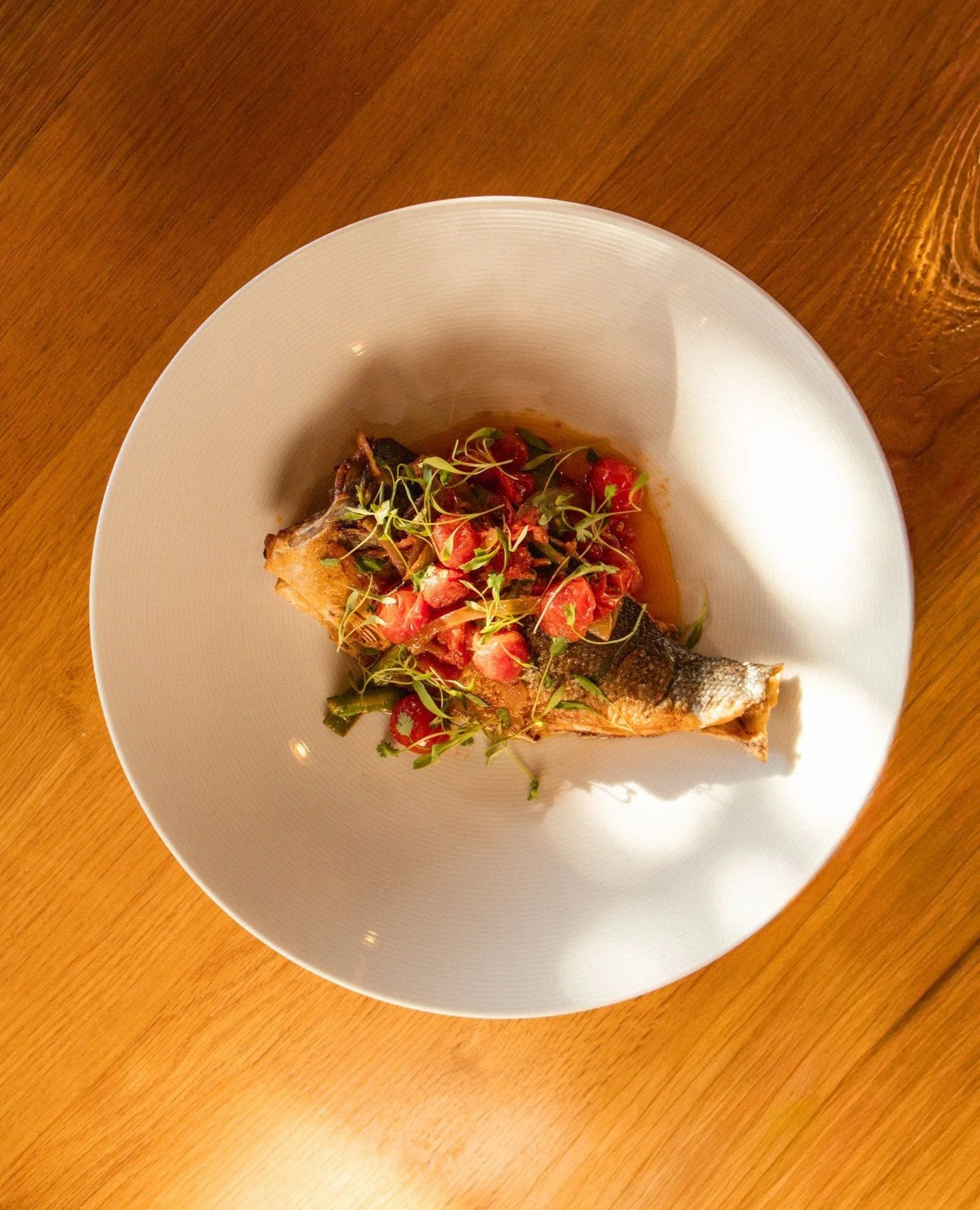 If you haven't tried our Ye-Asa Tibs yet, this is your sign!⁠
⁠
Ye-Asa Tibs (Whole Fish) // Branzino whole fish, fried and topped with onions, garlic, tomatoes and seeded jalape&ntilde;o peppers (not included in the messob options)⁠
⁠
⁠
⁠
⁠
⁠
#chicag