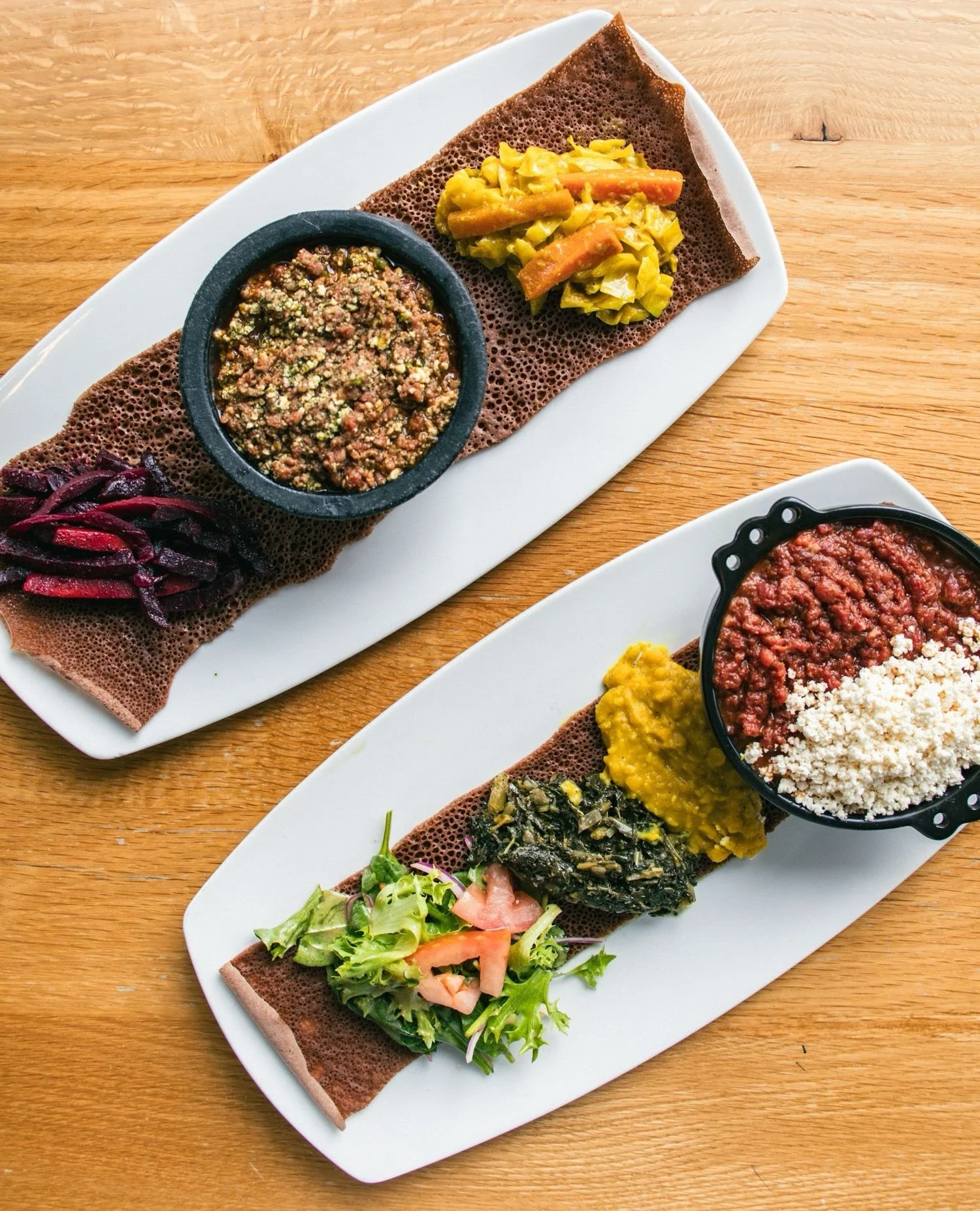 Two versions of our delicious Kifto ✨⁠
⁠
Kifto // Ethiopian steak tartare with herbed butter sauce, mitmita and side of ayib (farmer&rsquo;s cheese)⁠
⁠
Special Kifto // Ethiopian steak tartare mixed with ayib (farmer&rsquo;s cheese) and collard green