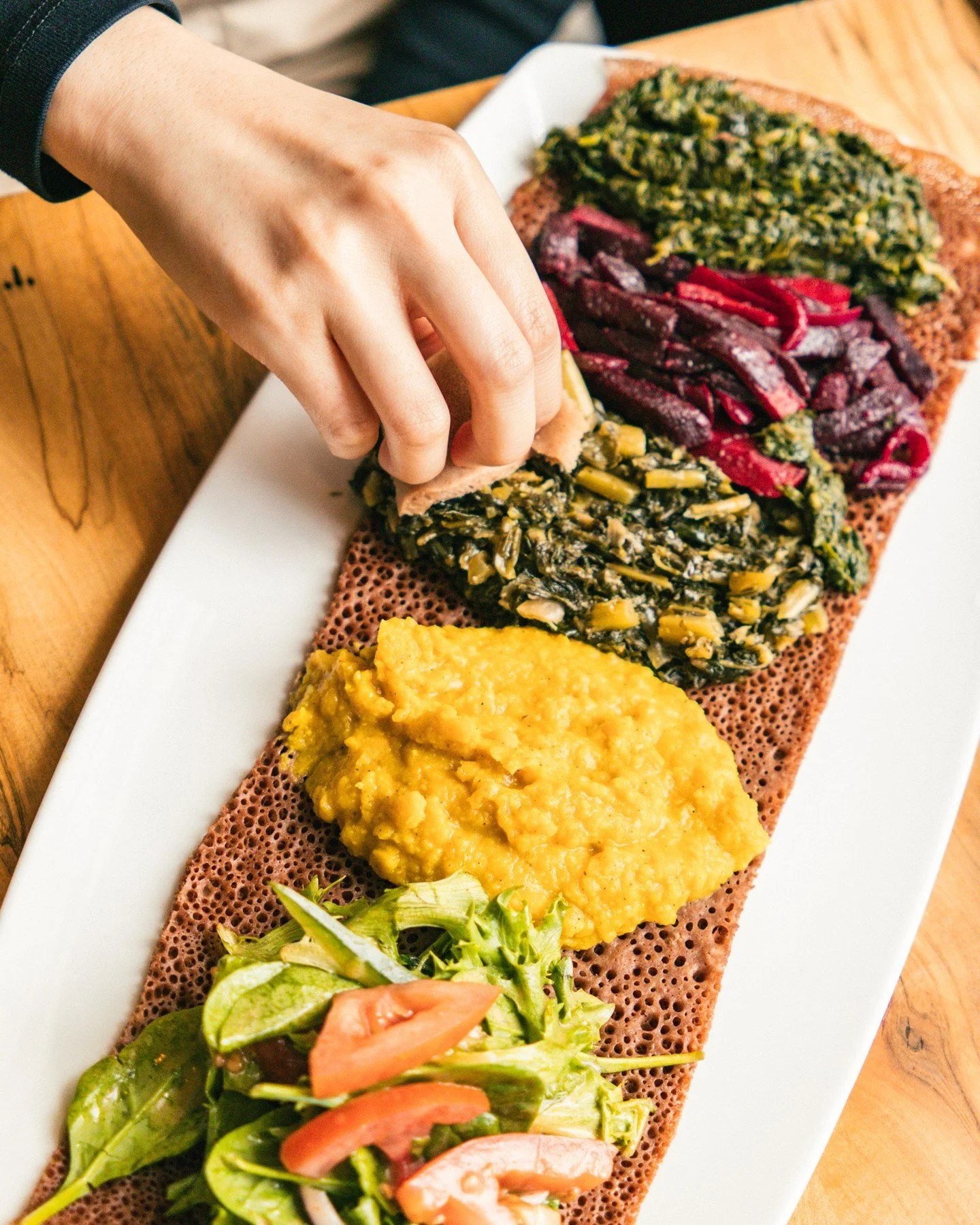 A solo dinner date at Demera is always a good idea 🧡⁠
⁠
Our Messobs can be made for one! It's the perfect way to try a few different dishes with a side of injera.⁠
⁠
⁠
⁠
⁠
#solodining #chicagofood #chicagorestaurant