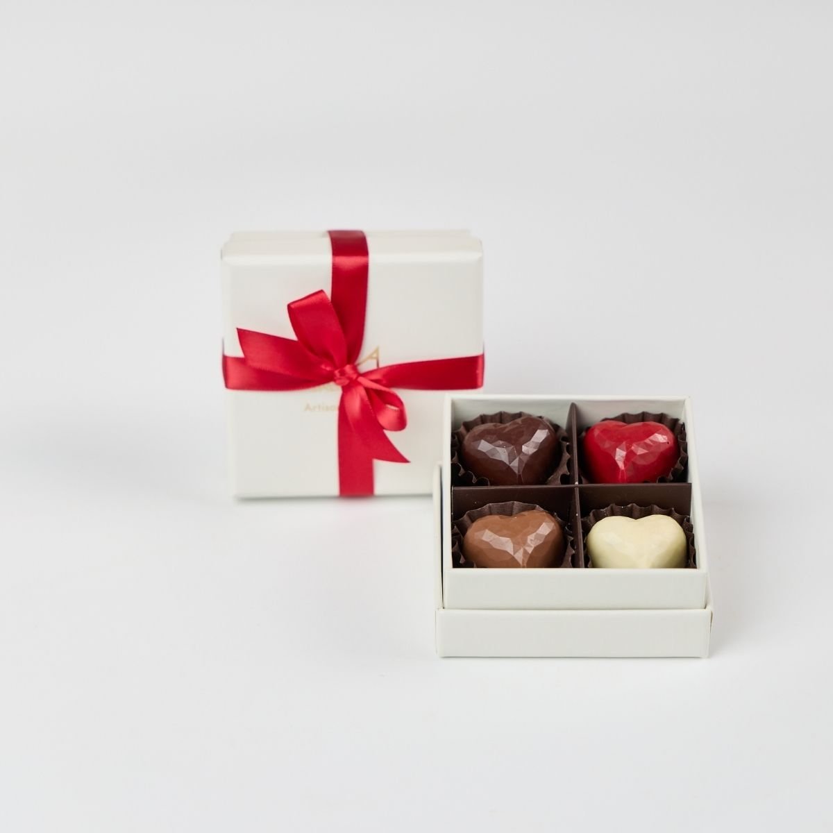 little gift boxes of 4 heart chocolate bonbons for valentine's day